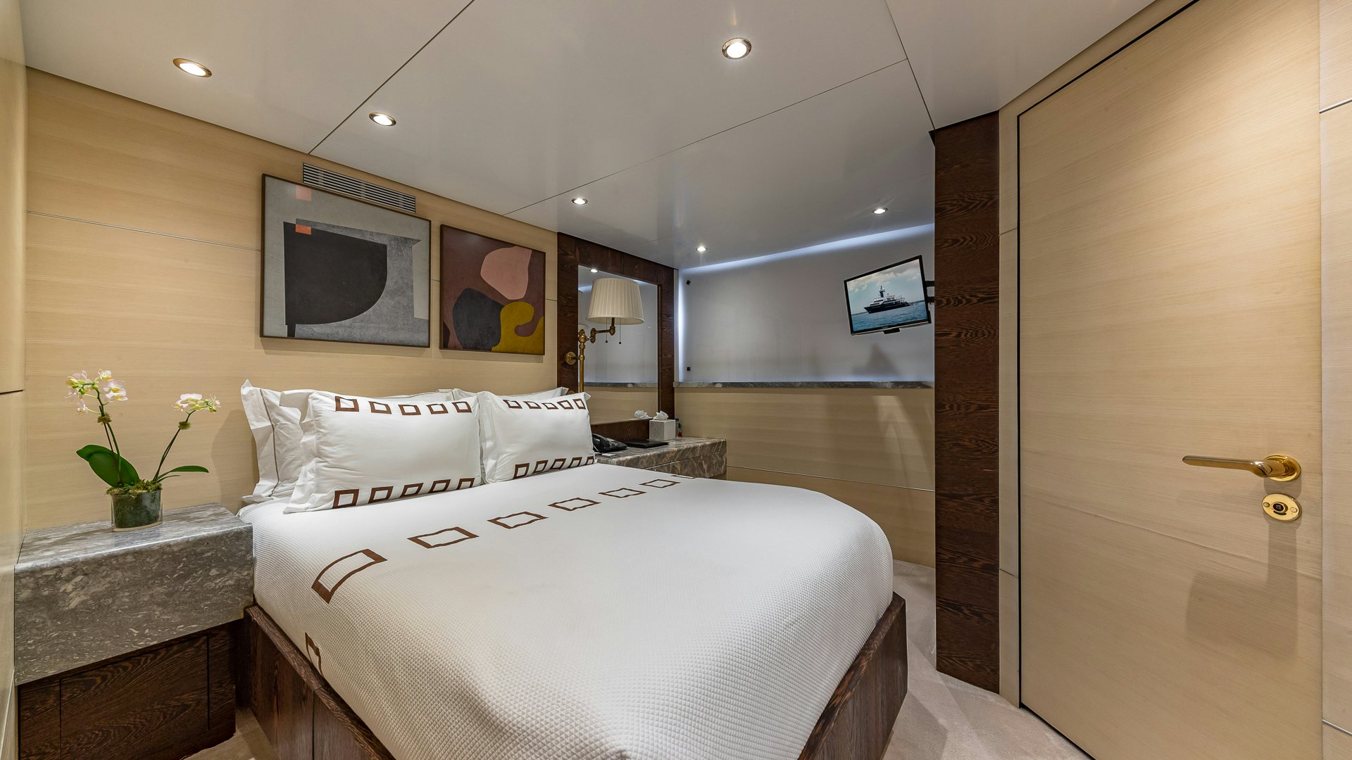 a hotel room with a bed aboard HIGHLANDER Yacht for Charter