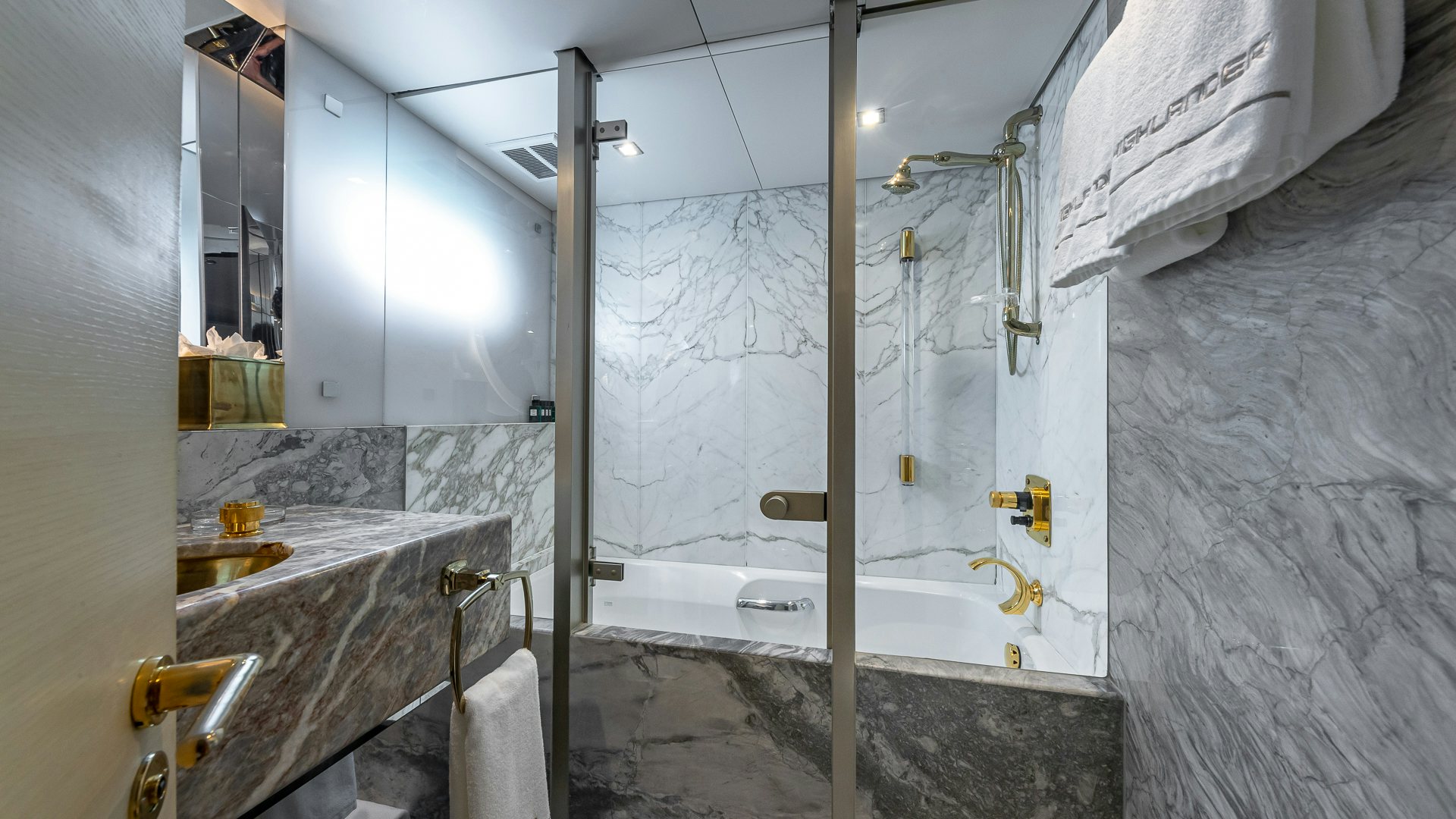 a bathroom with a large shower aboard HIGHLANDER Yacht for Charter