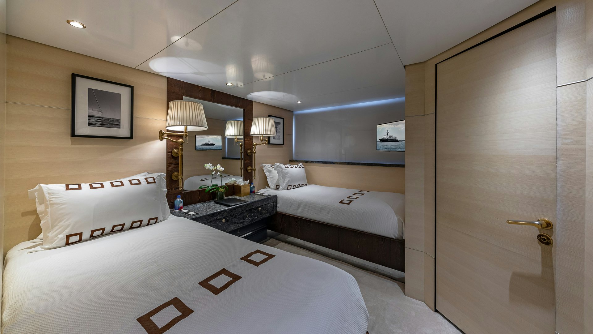 a room with two beds aboard HIGHLANDER Yacht for Charter