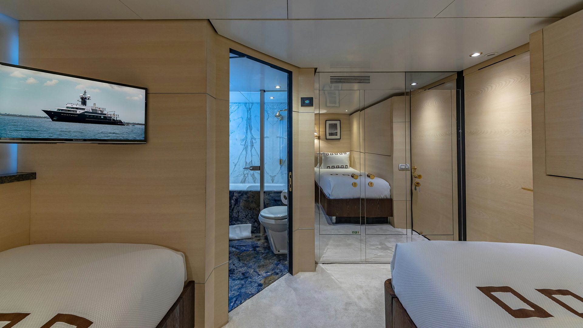 a bathroom with a bed and a bathtub aboard HIGHLANDER Yacht for Charter
