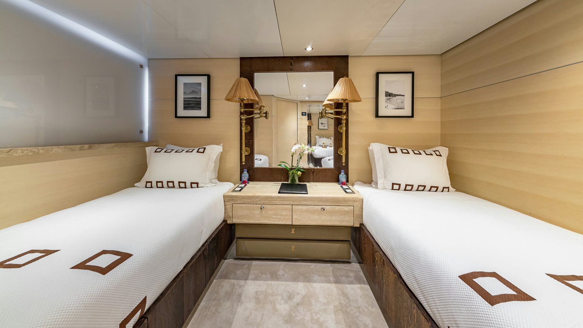 a room with a couple of beds aboard HIGHLANDER Yacht for Charter