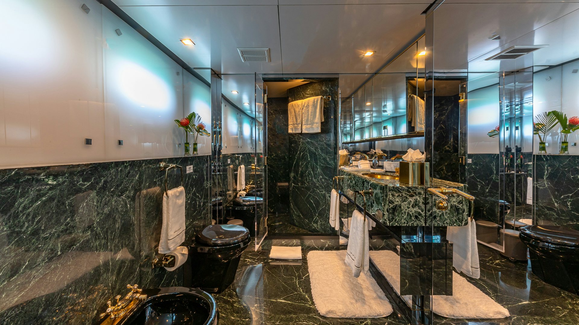 a bathroom with a large marble counter aboard HIGHLANDER Yacht for Charter