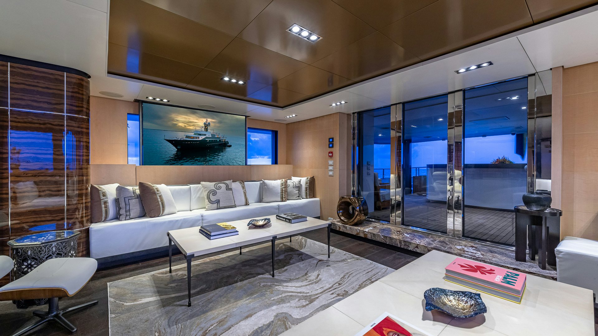 a large room with a large bed and a large window aboard HIGHLANDER Yacht for Charter