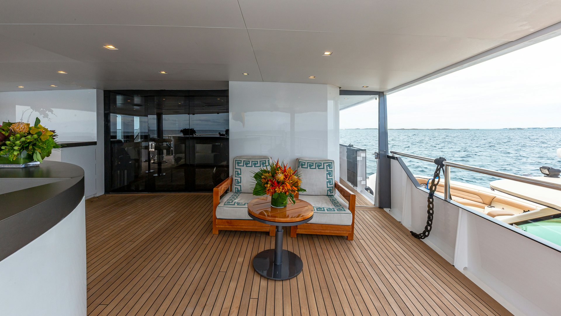 a room with a table and chairs aboard HIGHLANDER Yacht for Charter