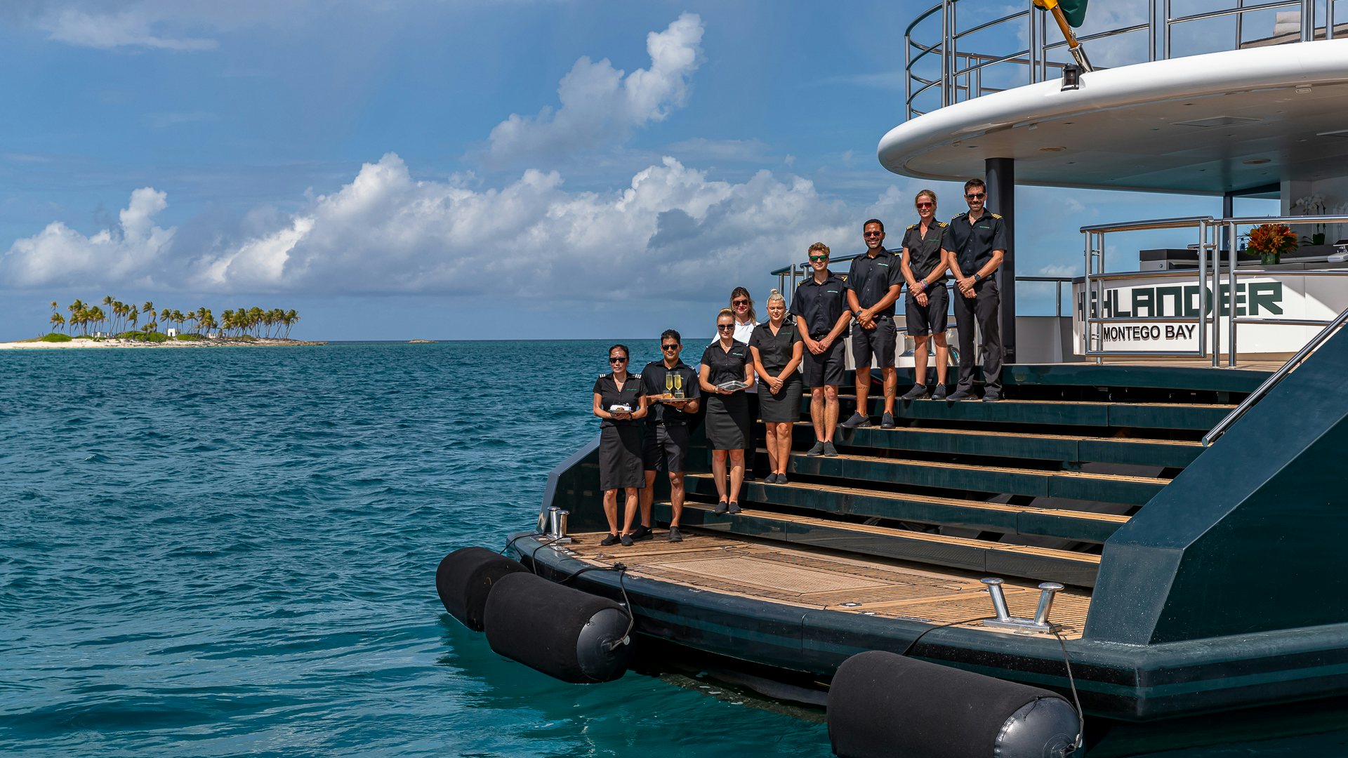 a group of people on a boat aboard HIGHLANDER Yacht for Charter