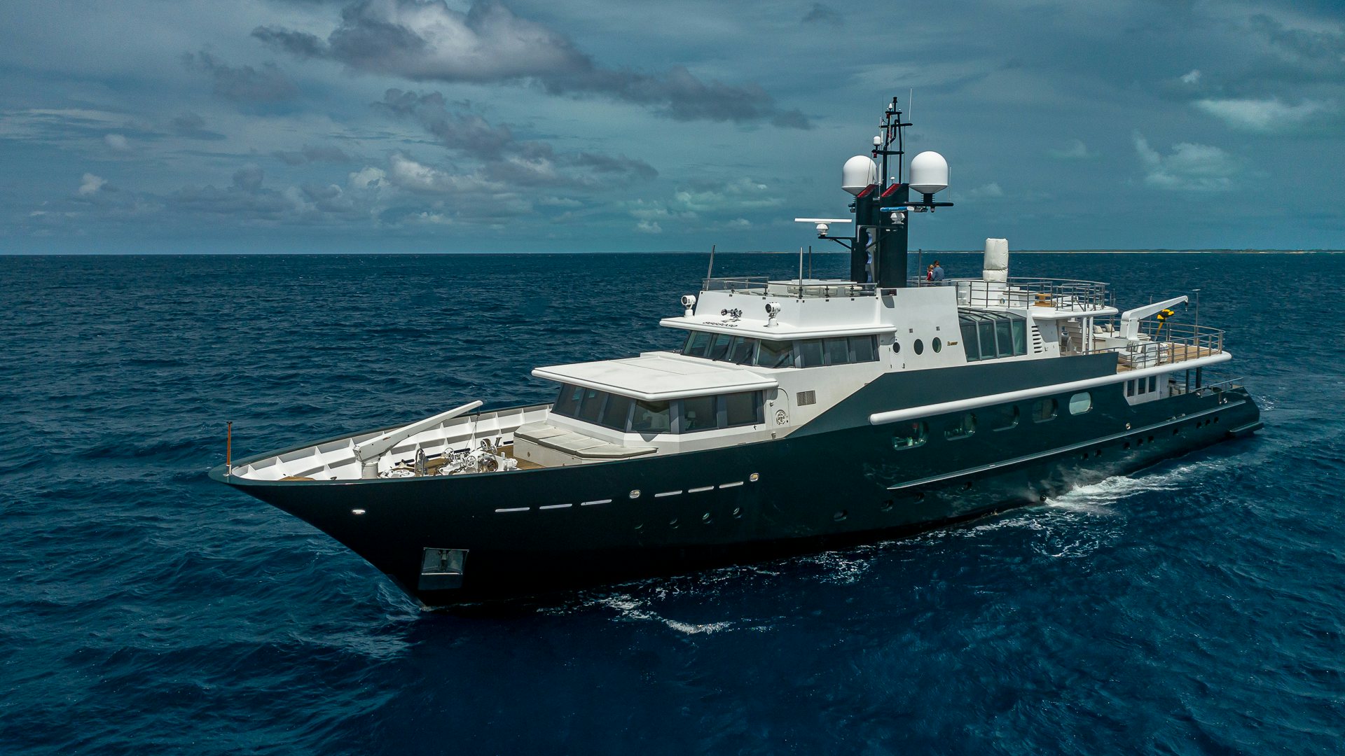 a large boat in the water aboard HIGHLANDER Yacht for Charter