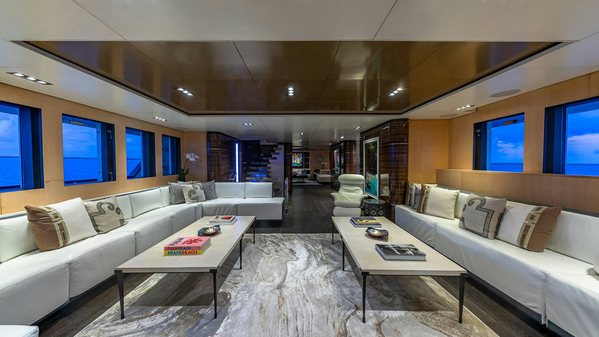 a living room with a couch and a coffee table aboard HIGHLANDER Yacht for Charter