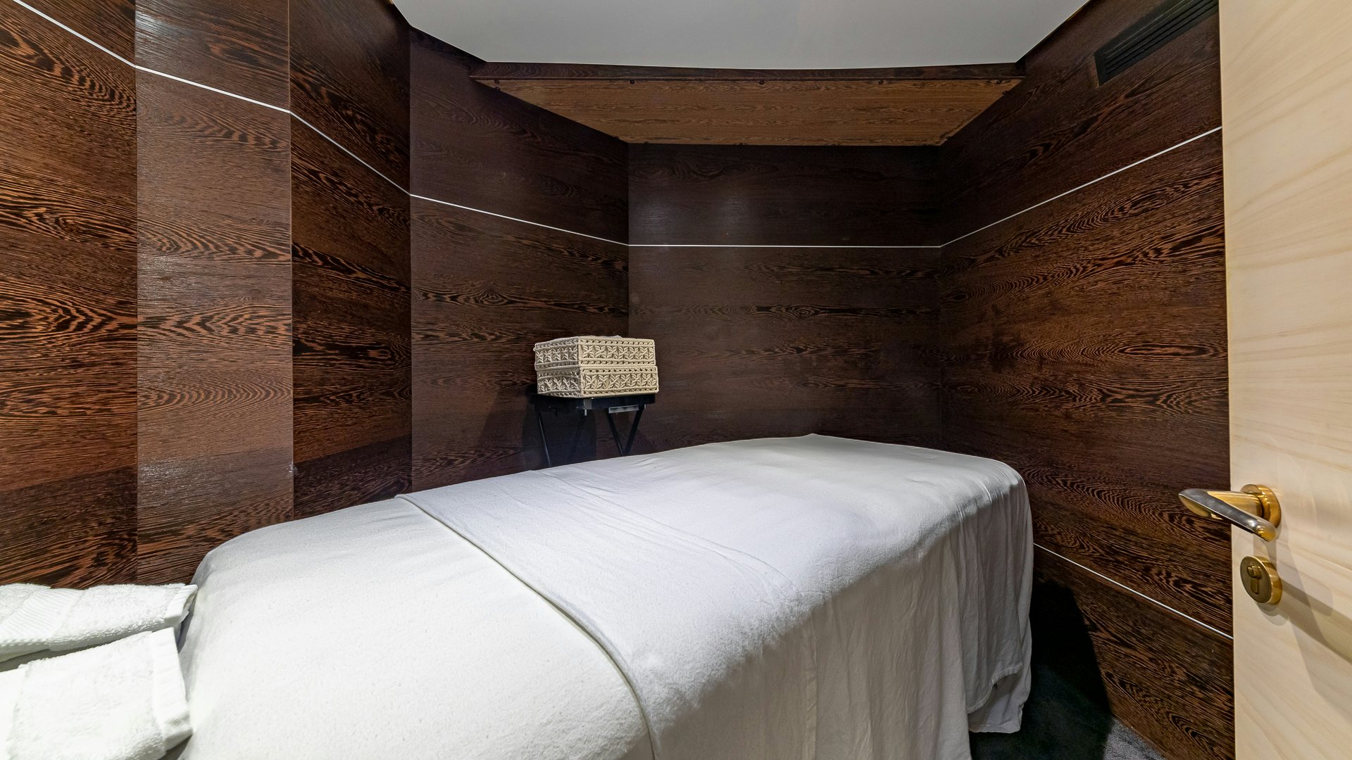 a bed in a room aboard HIGHLANDER Yacht for Charter