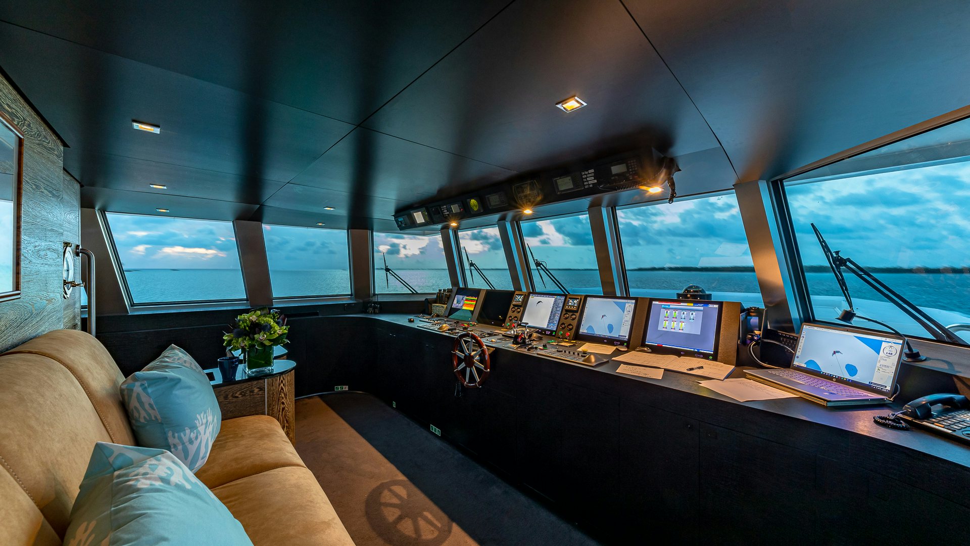 an office with a desk and a laptop aboard HIGHLANDER Yacht for Charter