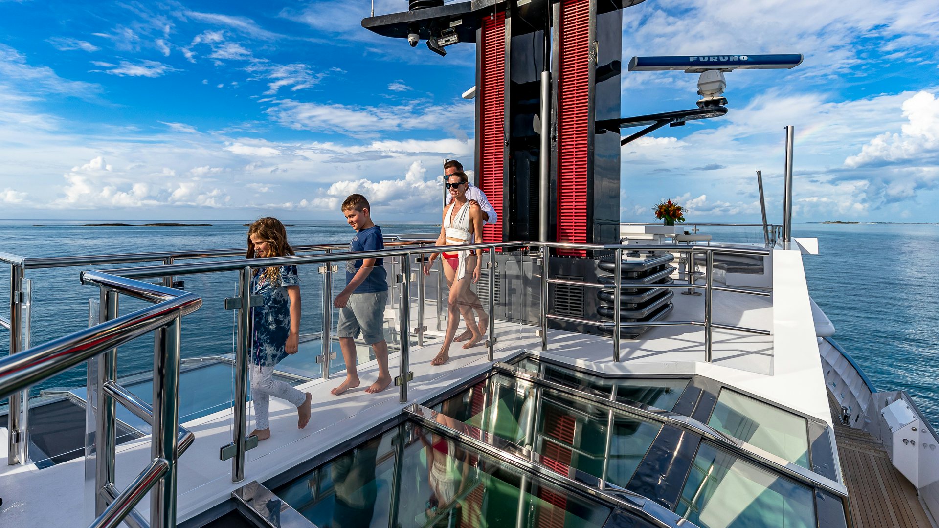 a group of people on a boat aboard HIGHLANDER Yacht for Charter