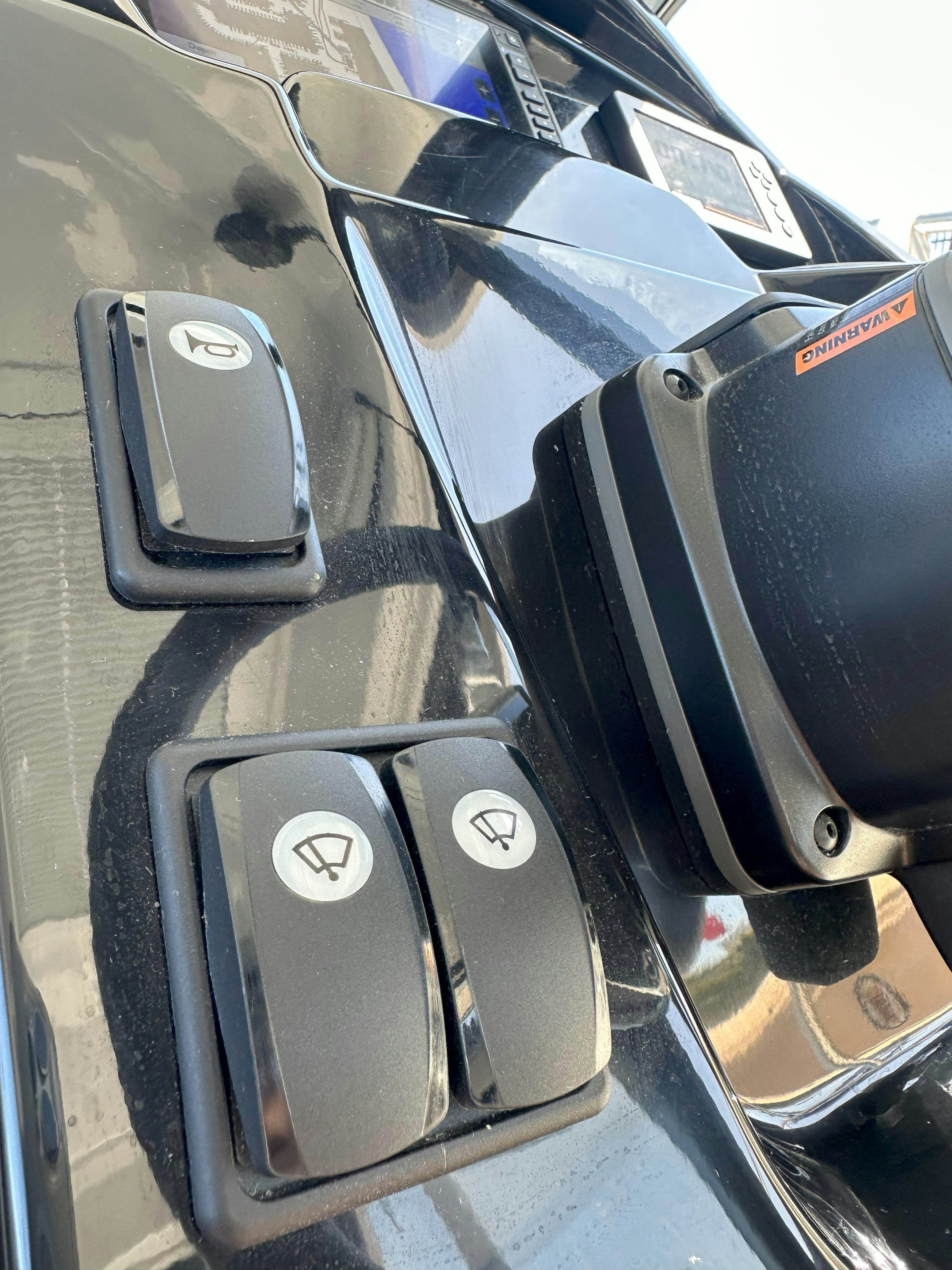 a close-up of a car's dashboard aboard DESTINATION UNKNOWN II Yacht for Sale