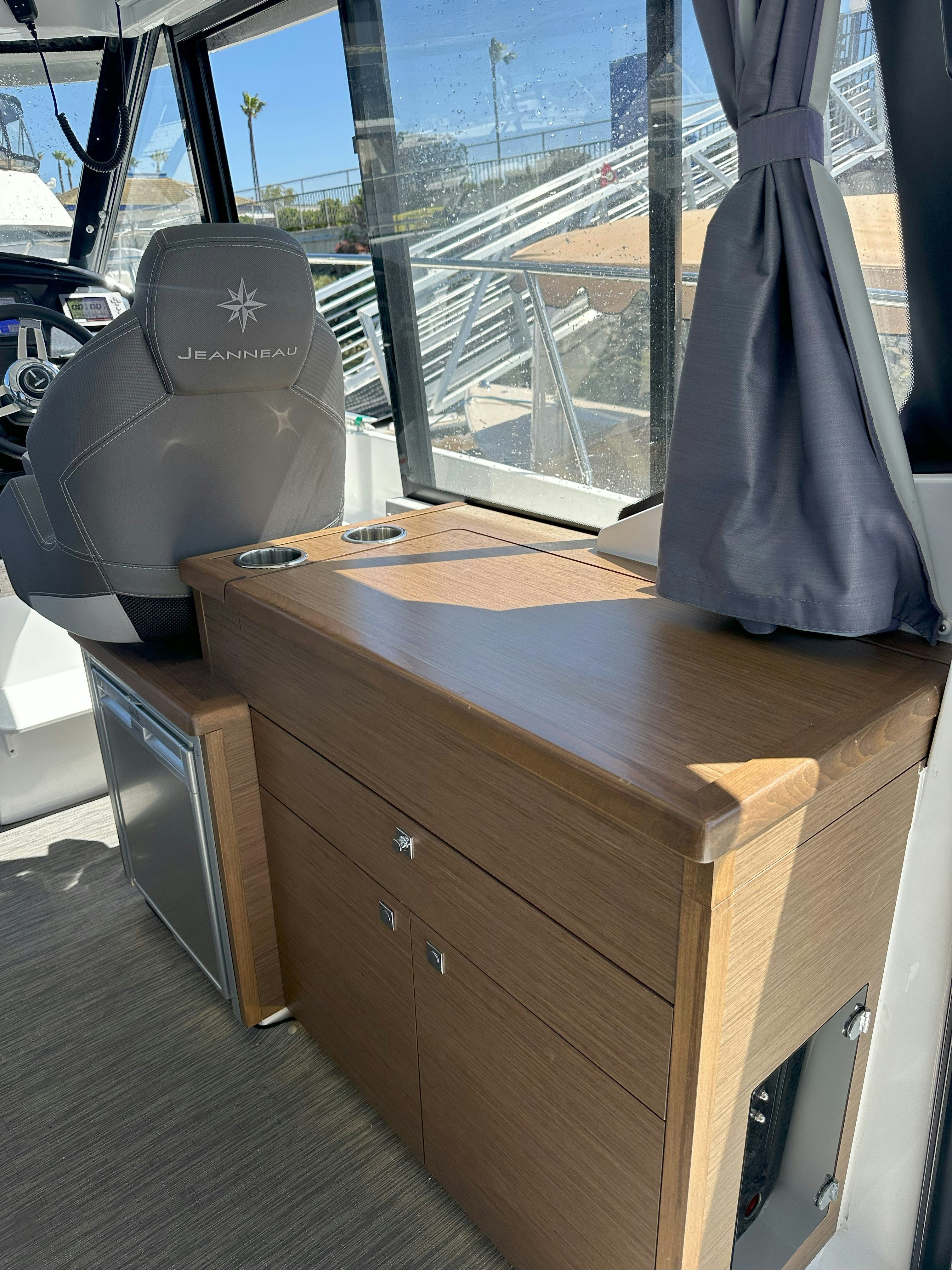 a desk with a computer on it aboard DESTINATION UNKNOWN II Yacht for Sale