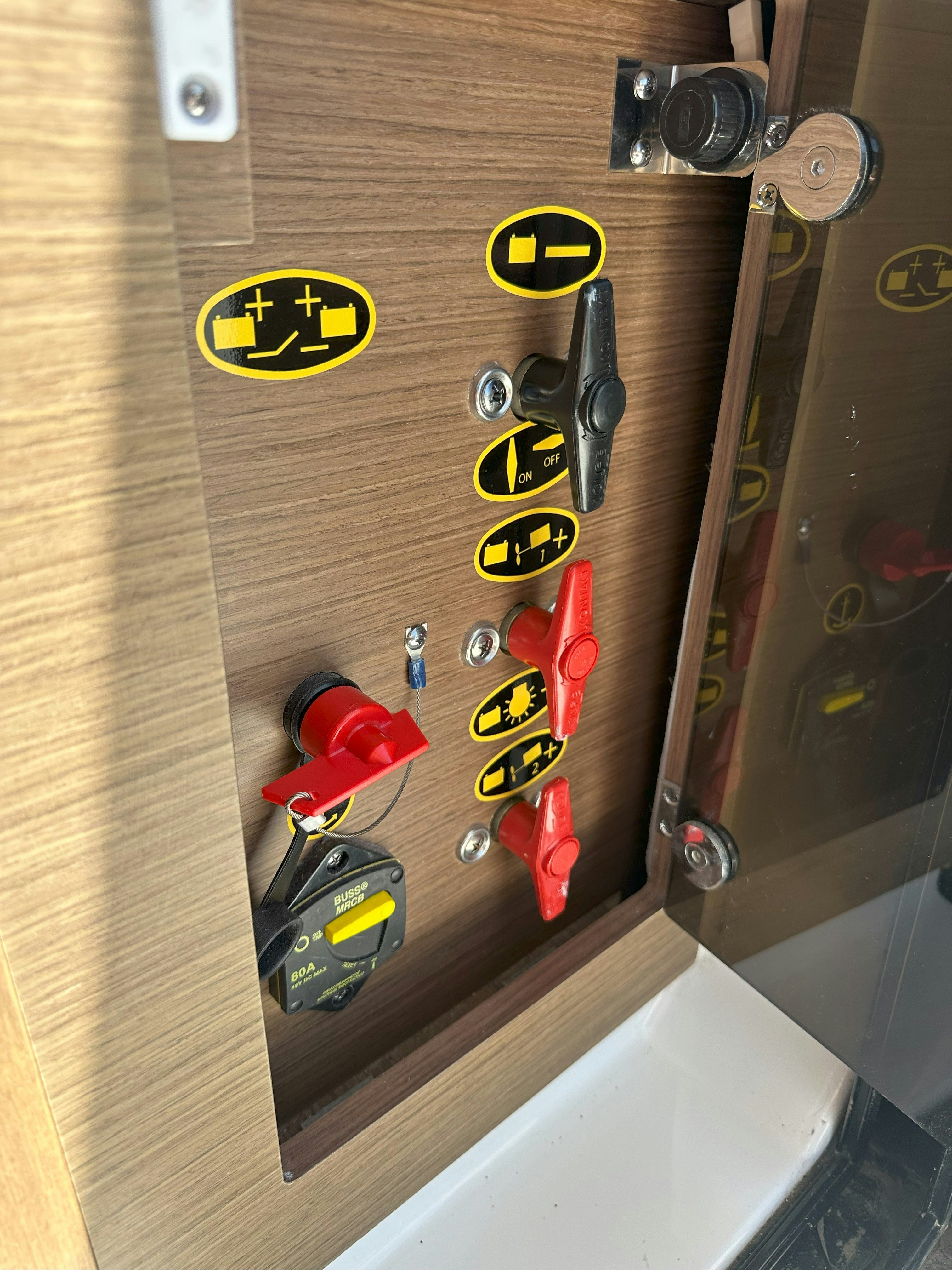 a wall with many buttons and dials aboard DESTINATION UNKNOWN II Yacht for Sale