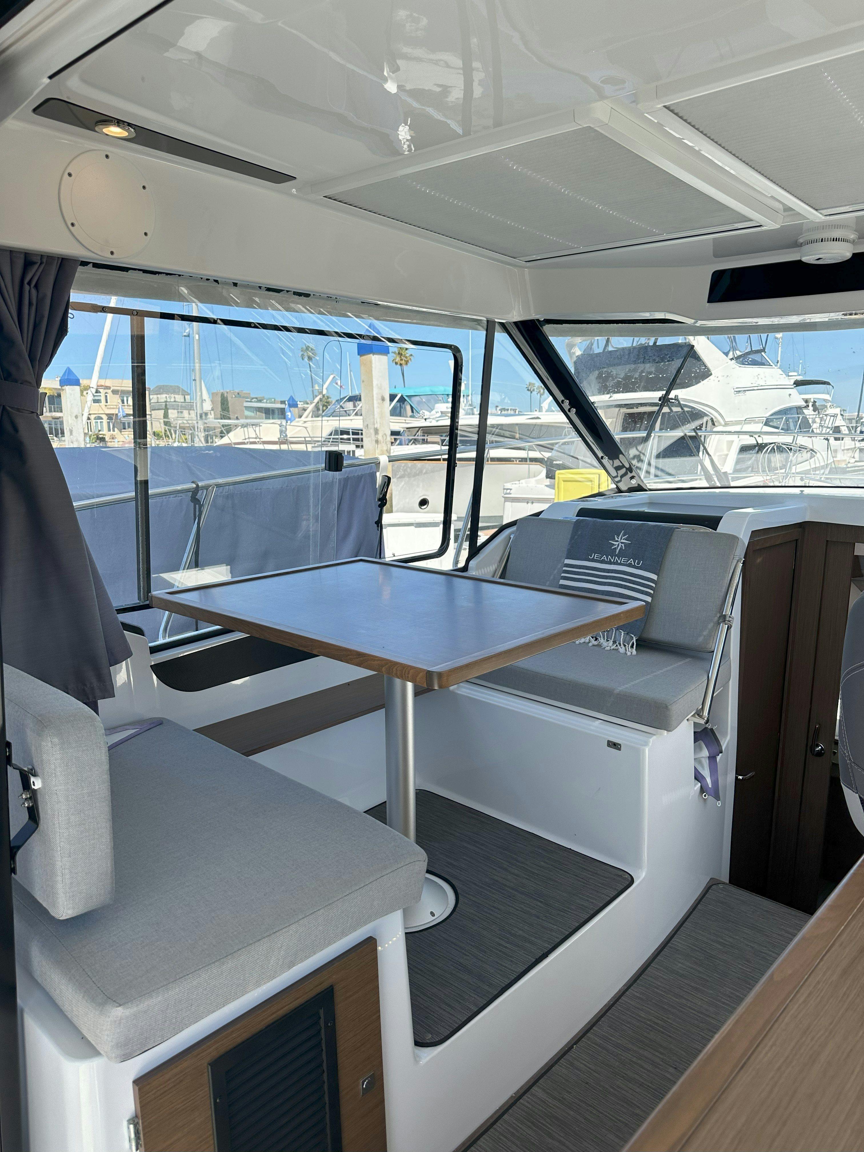 a table with a bench aboard DESTINATION UNKNOWN II Yacht for Sale