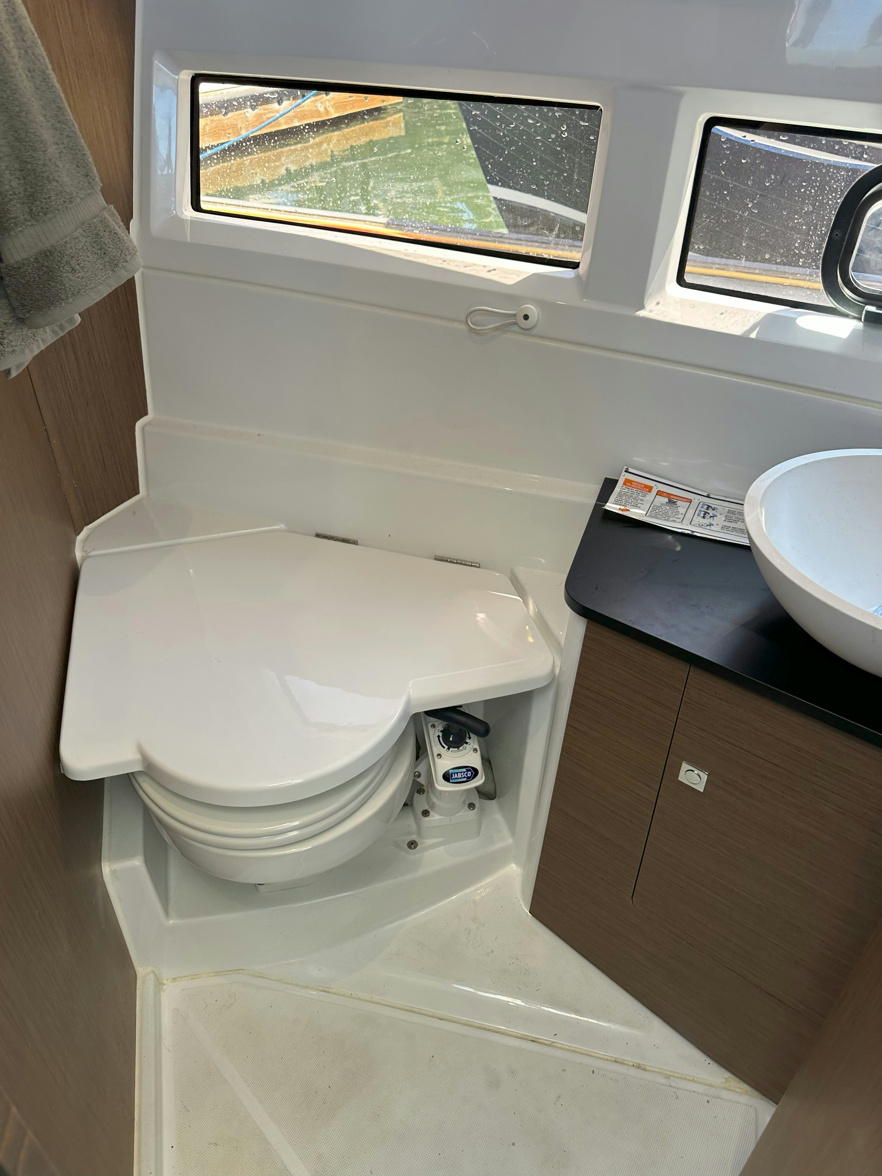 a toilet in a bathroom aboard DESTINATION UNKNOWN II Yacht for Sale