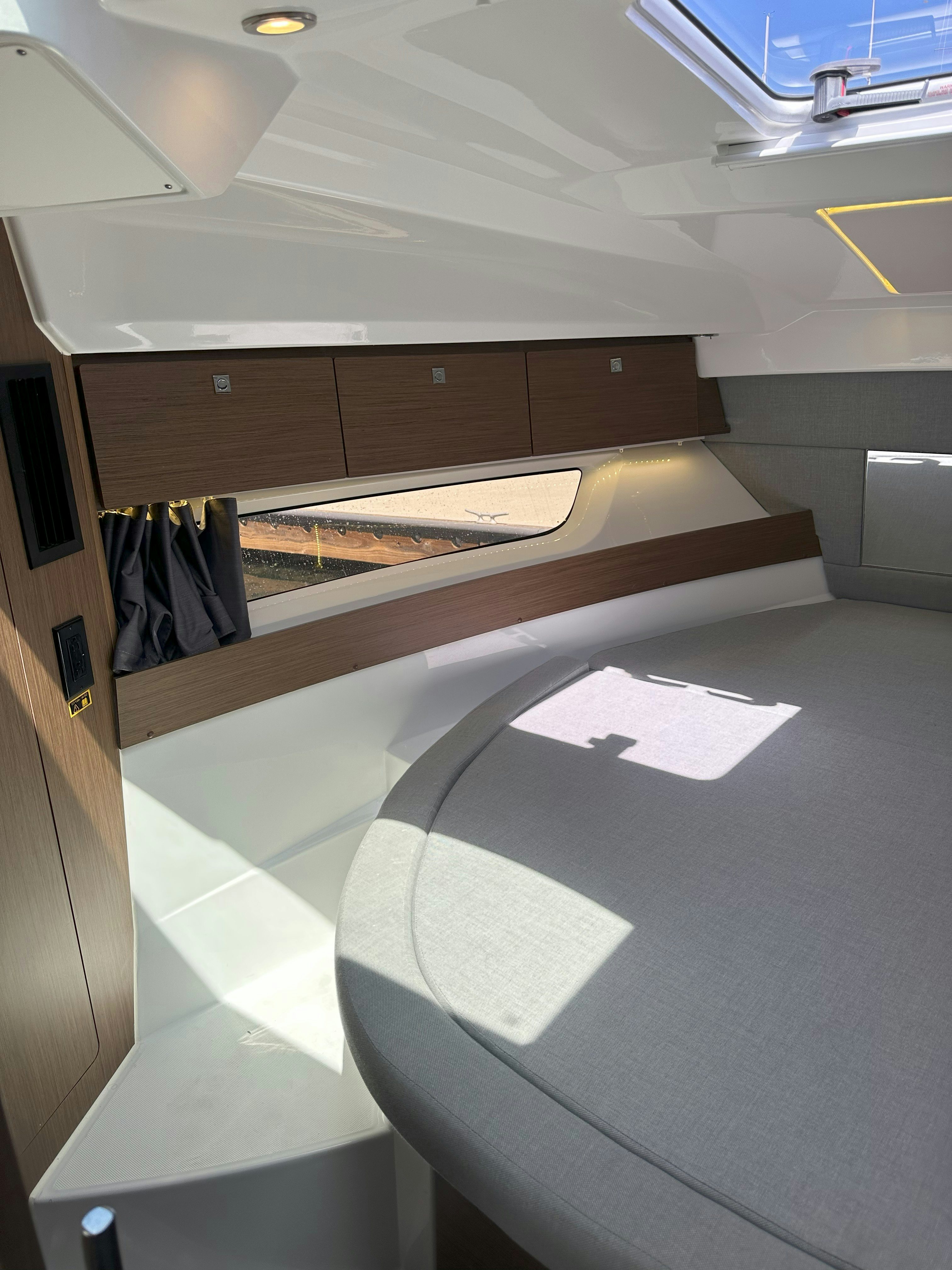 a room with a wood floor and a wood bench aboard DESTINATION UNKNOWN II Yacht for Sale