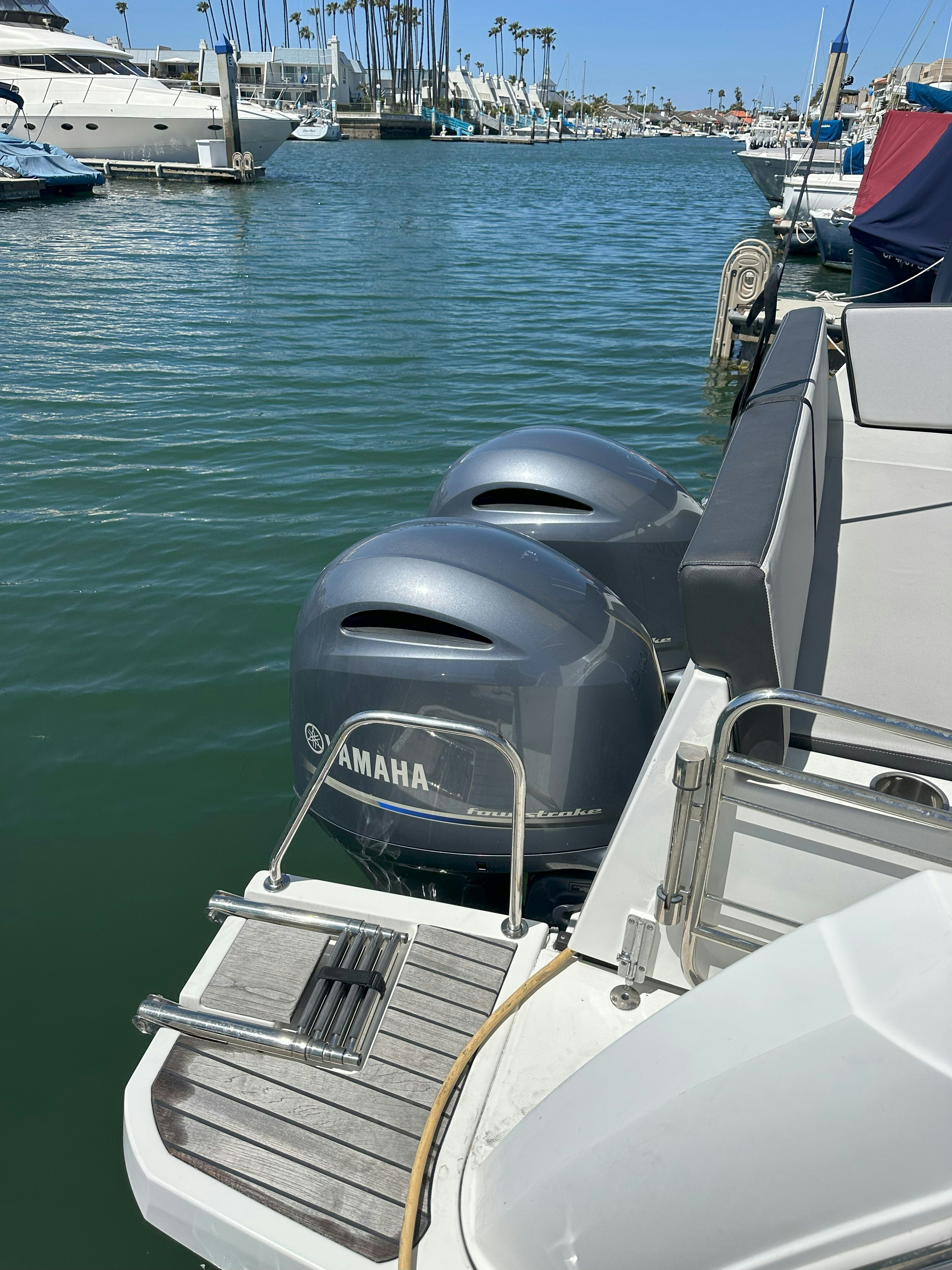a boat with a steering wheel aboard DESTINATION UNKNOWN II Yacht for Sale