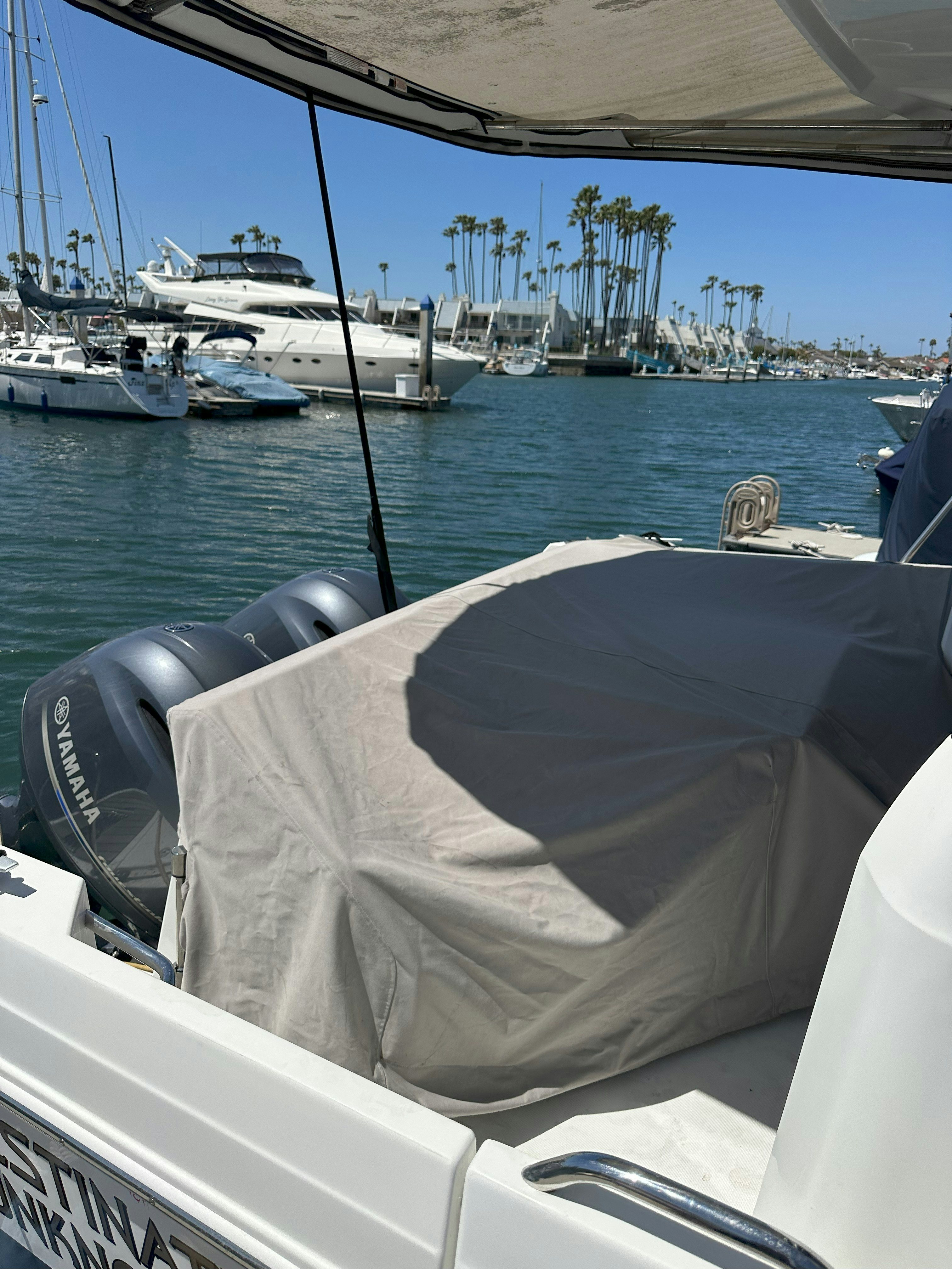 a boat in the water aboard DESTINATION UNKNOWN II Yacht for Sale