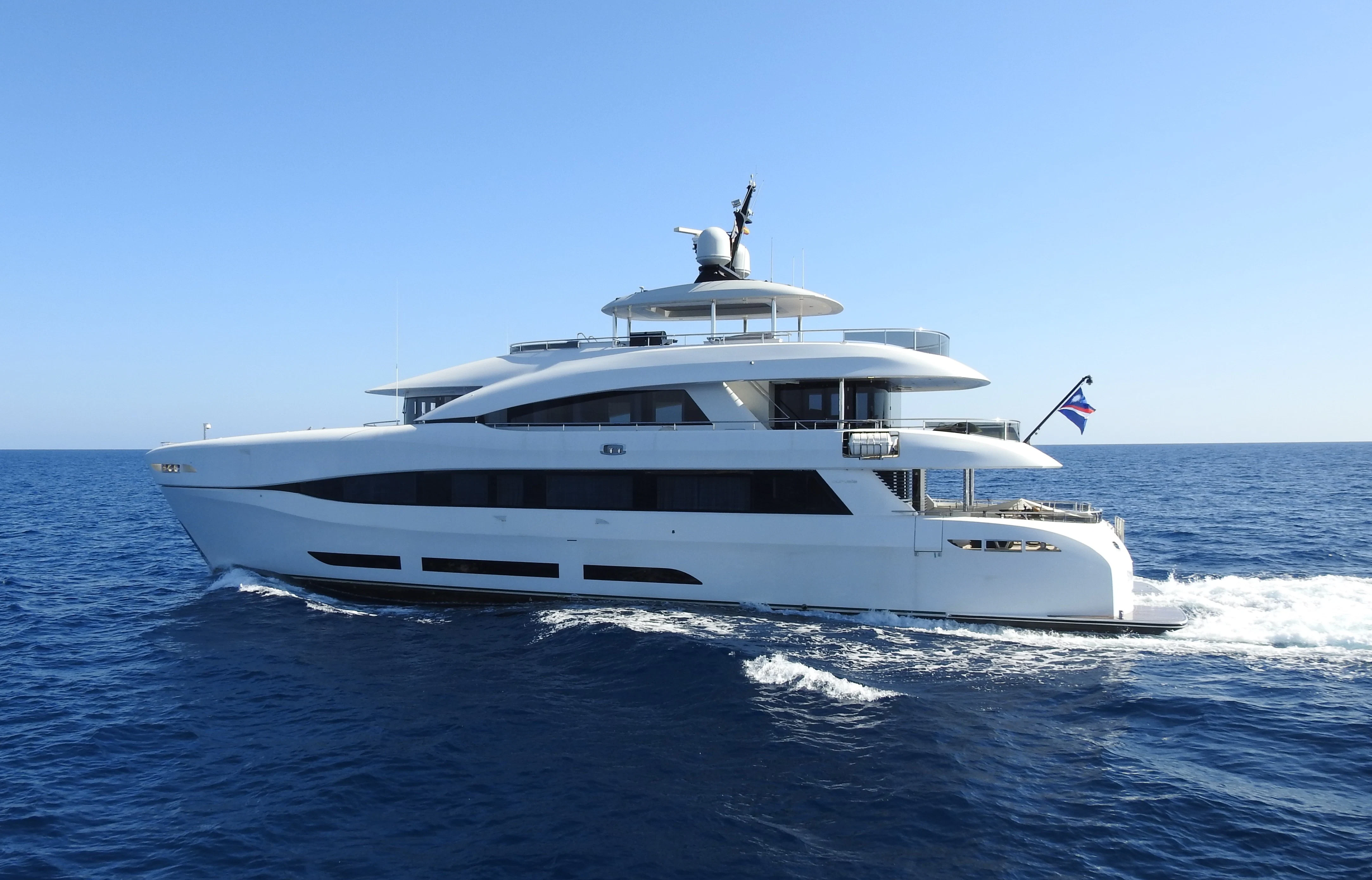 a white yacht on the water aboard SHU U RITE Yacht for Sale