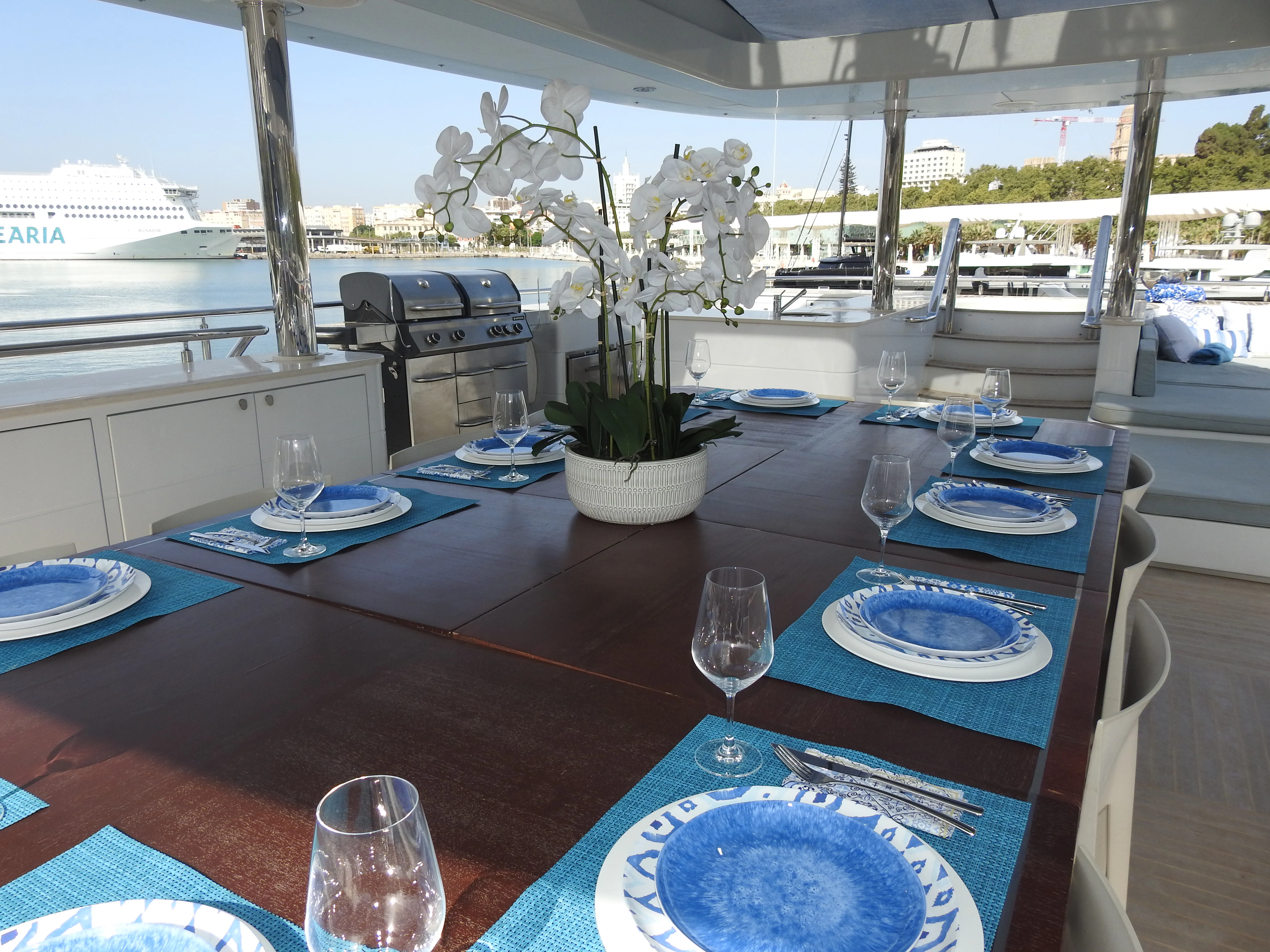 a table with plates and glasses aboard SHU U RITE Yacht for Sale