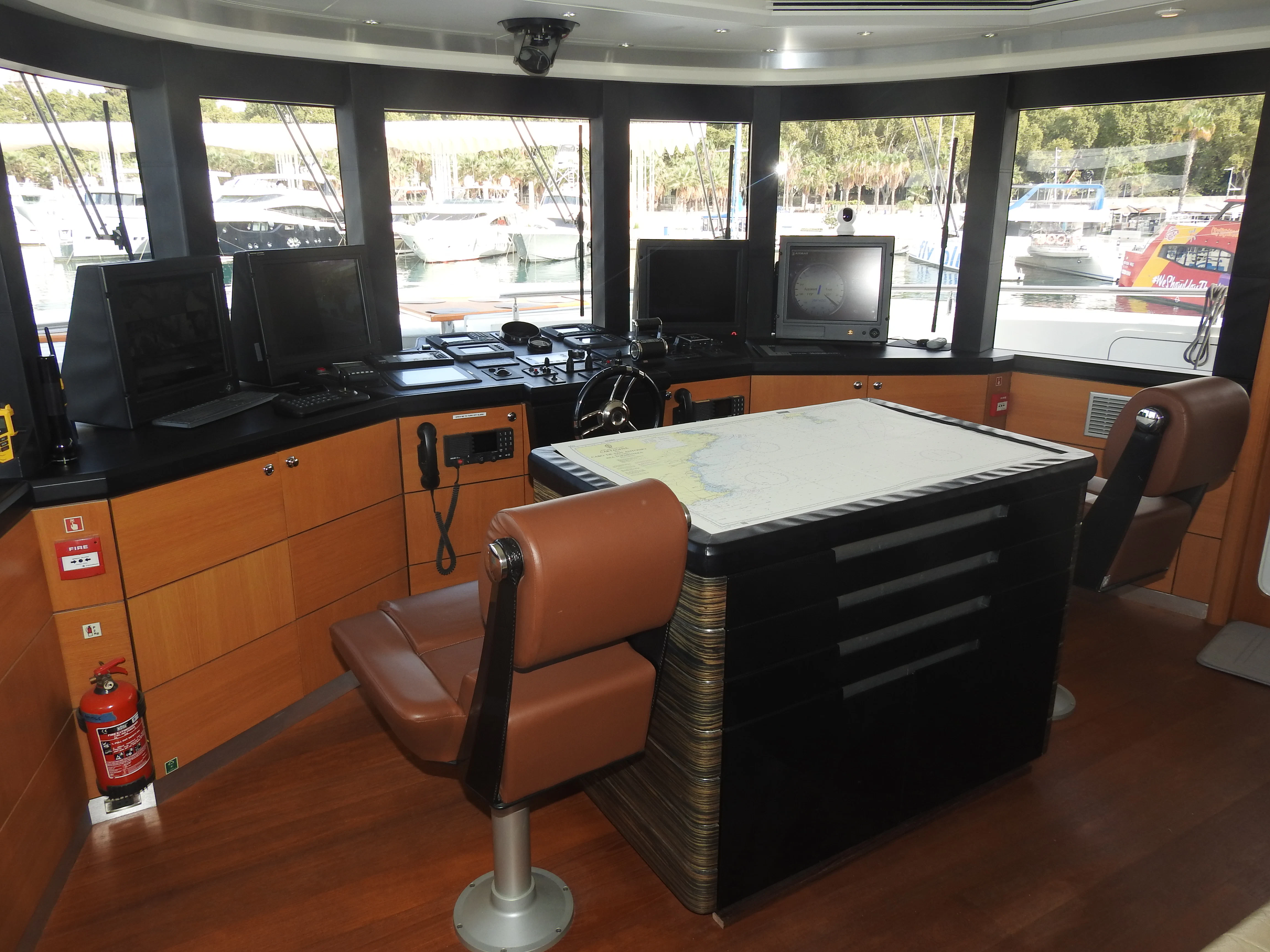 a room with a desk and chairs aboard SHU U RITE Yacht for Sale