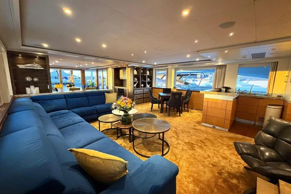a living room with a large window aboard SHU U RITE Yacht for Sale