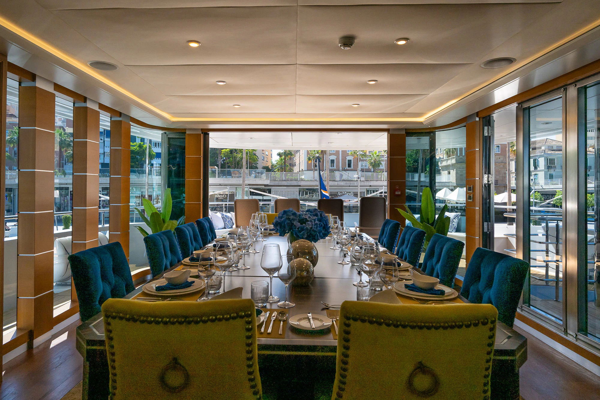 a large room with tables and chairs aboard SHU U RITE Yacht for Sale