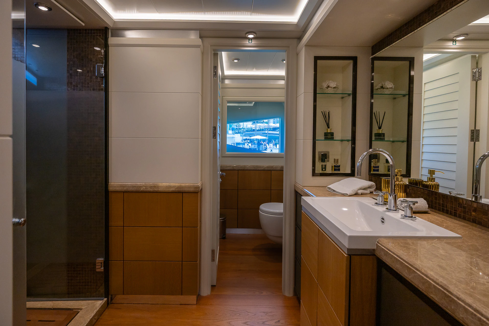 a bathroom with a sink and a mirror aboard SHU U RITE Yacht for Sale