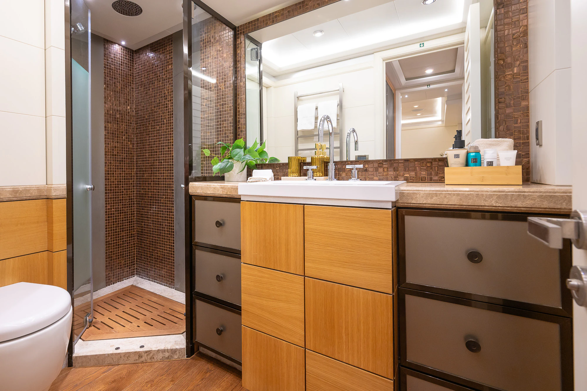 a bathroom with a sink and a shower aboard SHU U RITE Yacht for Sale