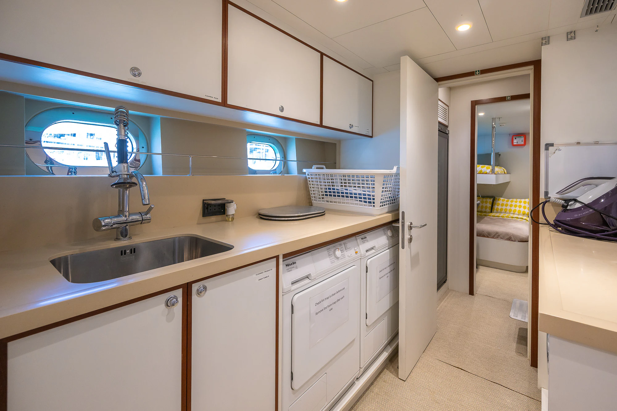 a kitchen with a sink and a bed aboard SHU U RITE Yacht for Sale