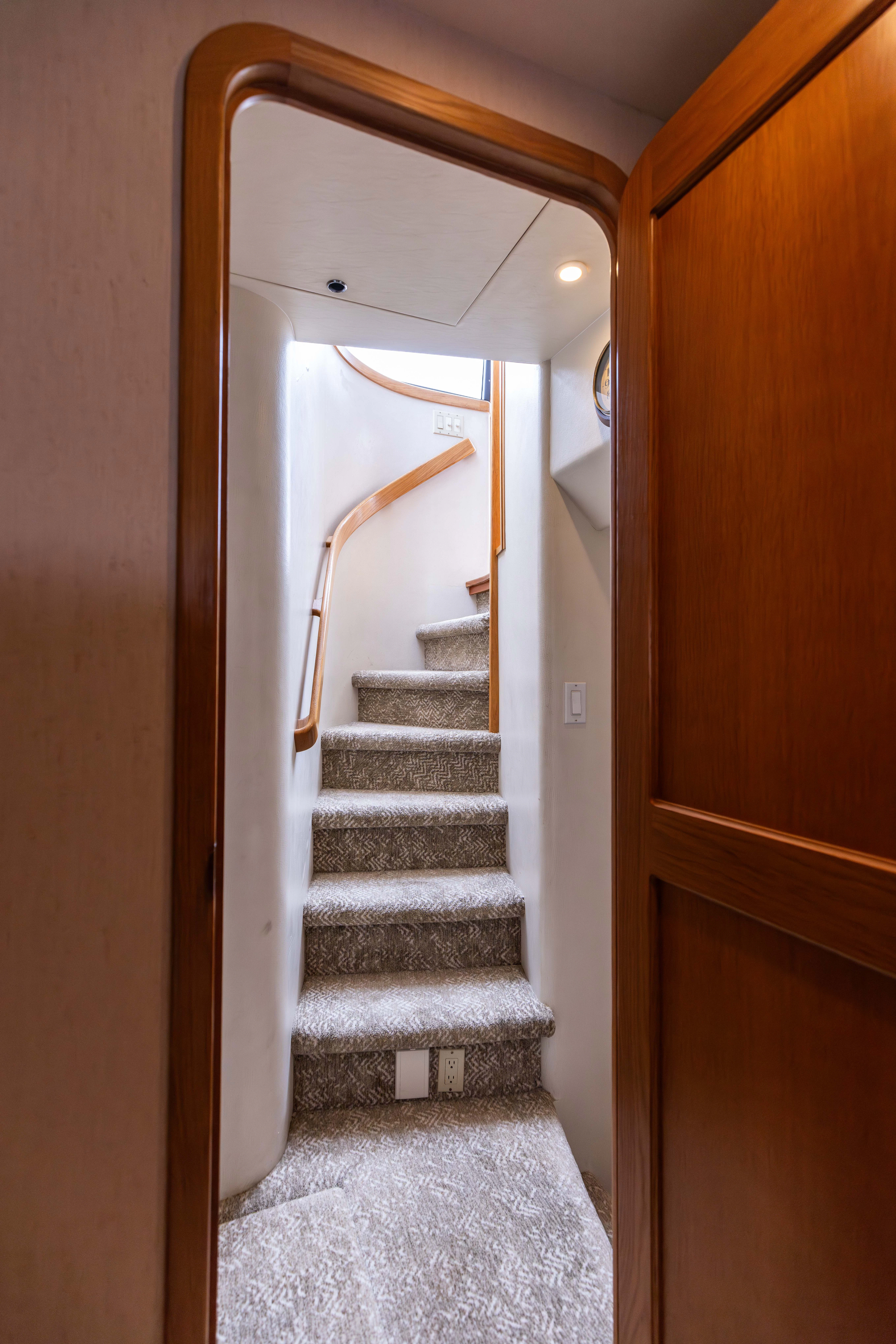 a stairway leading to a door aboard 3TEN Yacht for Sale