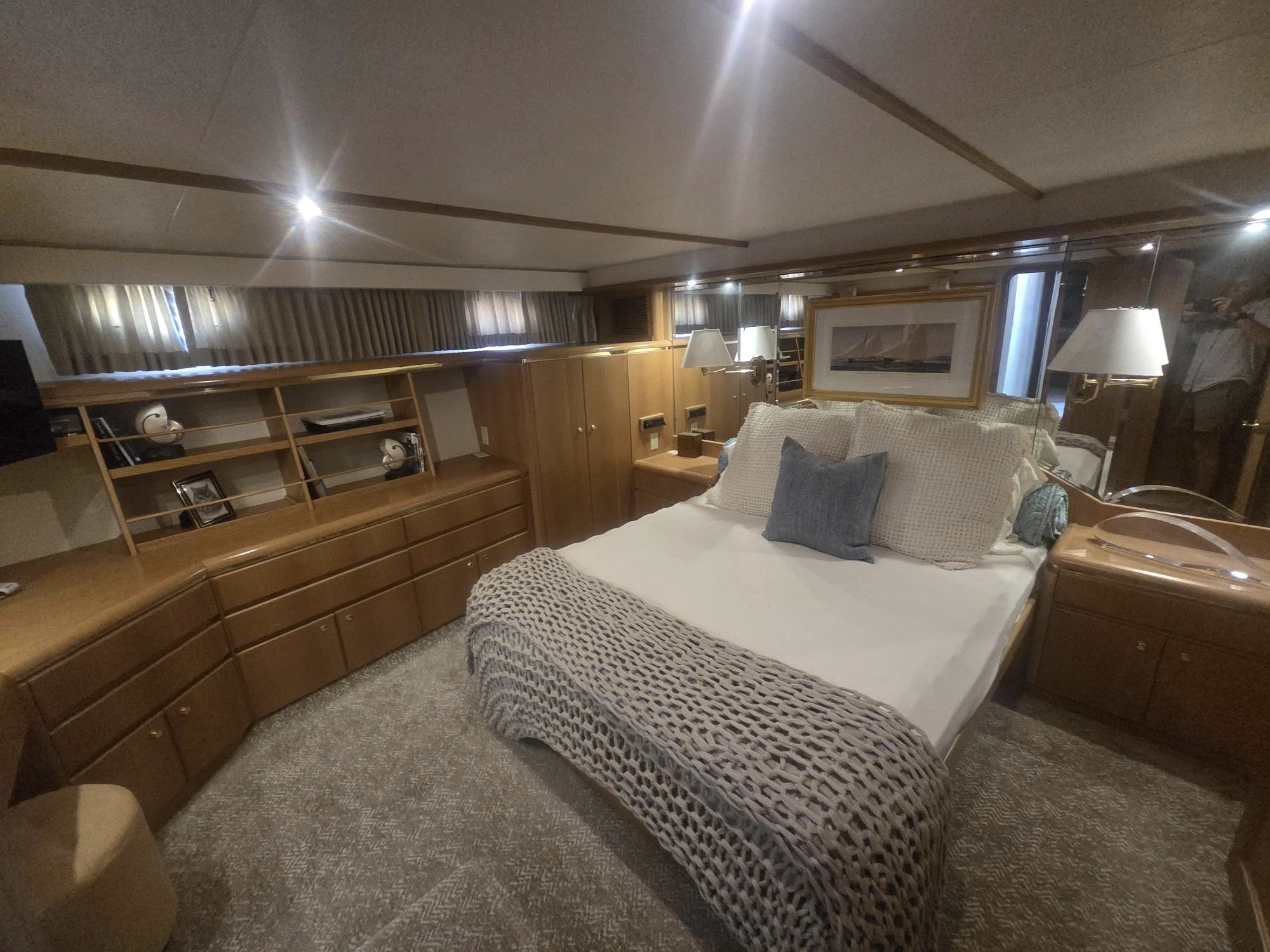 a bedroom with two beds aboard 3TEN Yacht for Sale