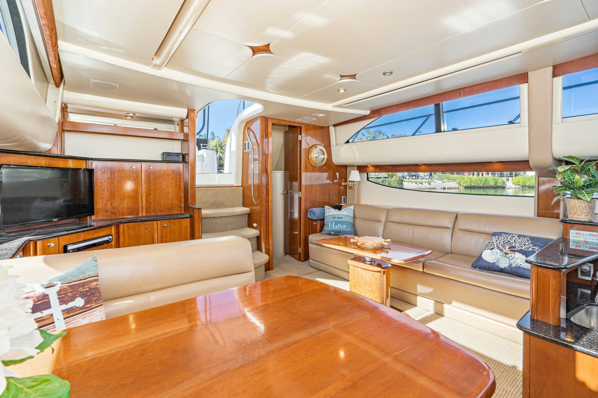 a living room with a wood floor aboard THE SEA IS FOR ME Yacht for Sale