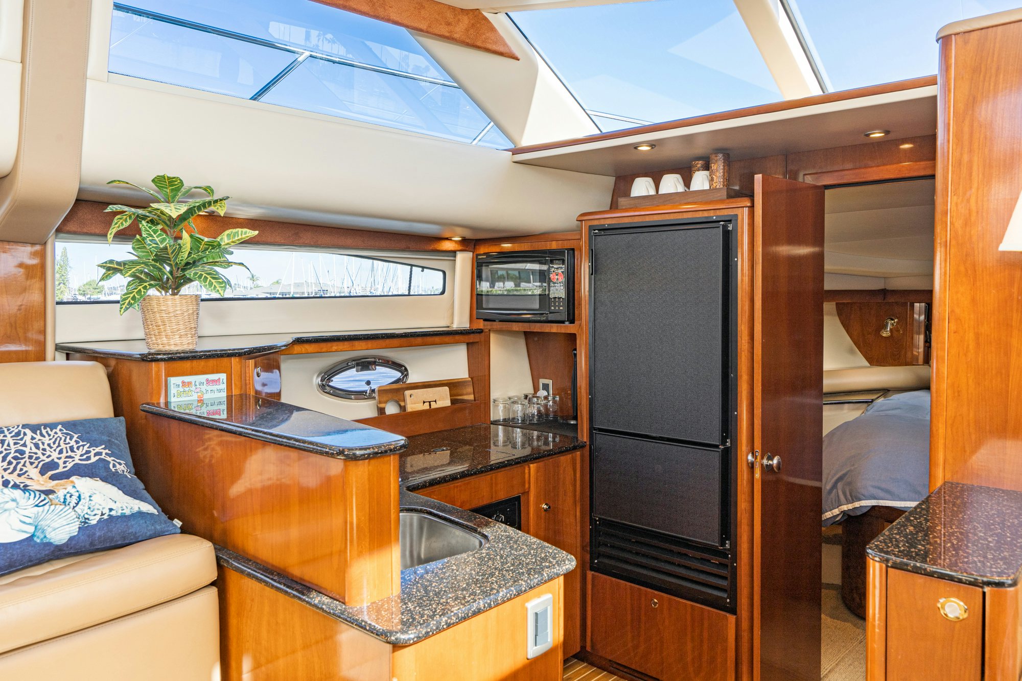 a room with a desk and a bed aboard THE SEA IS FOR ME Yacht for Sale