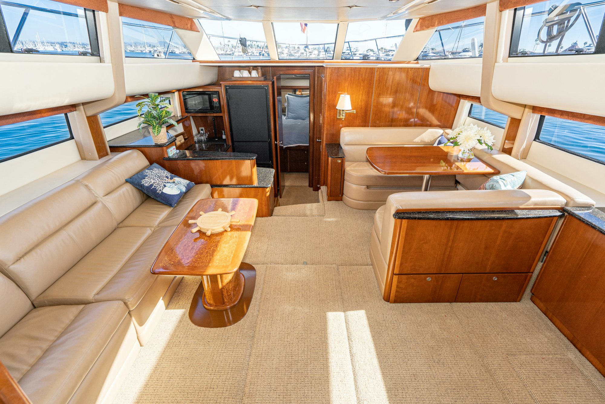 a living room with a couch and a coffee table aboard THE SEA IS FOR ME Yacht for Sale