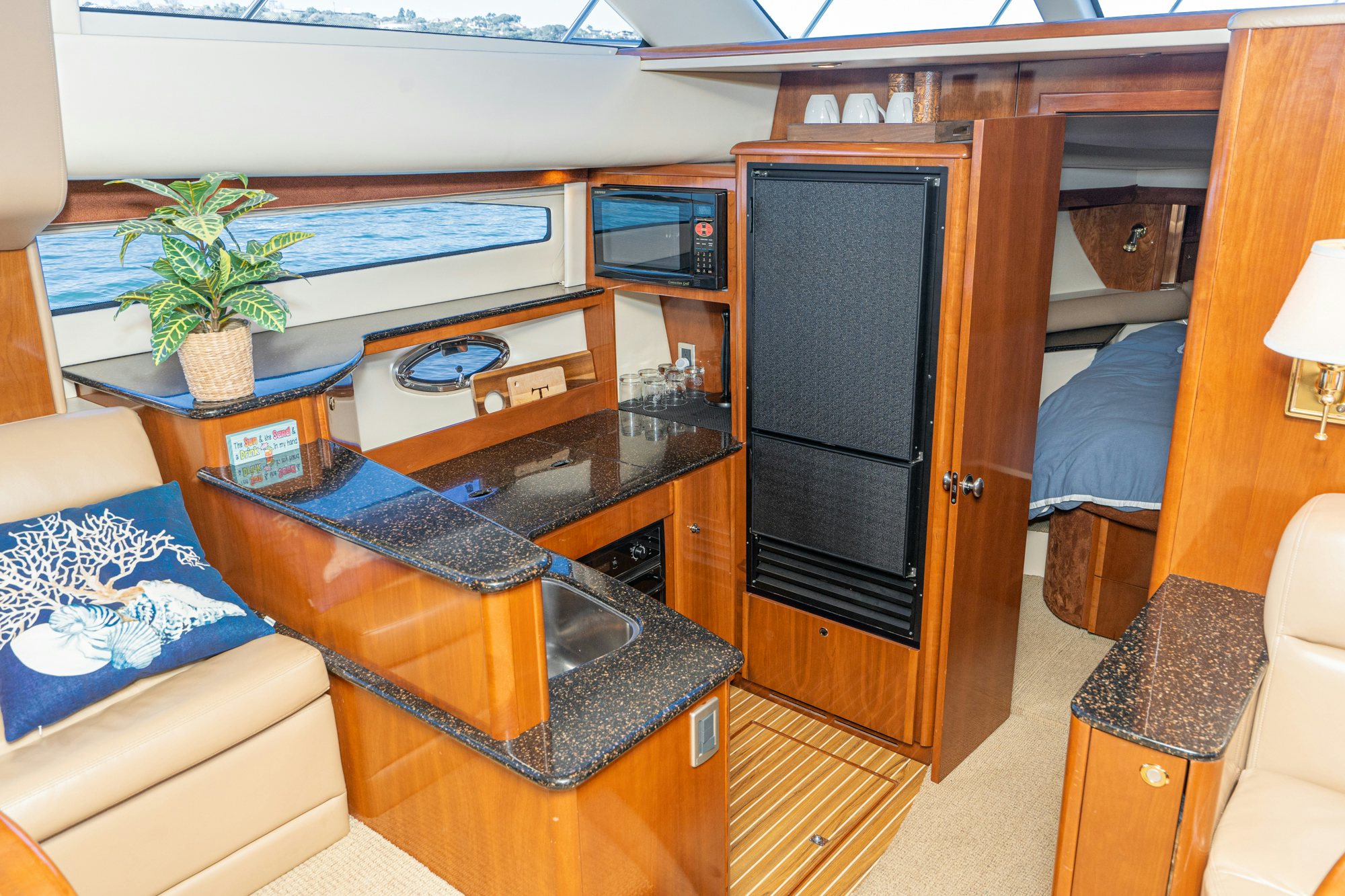 a room with a table and a couch aboard THE SEA IS FOR ME Yacht for Sale