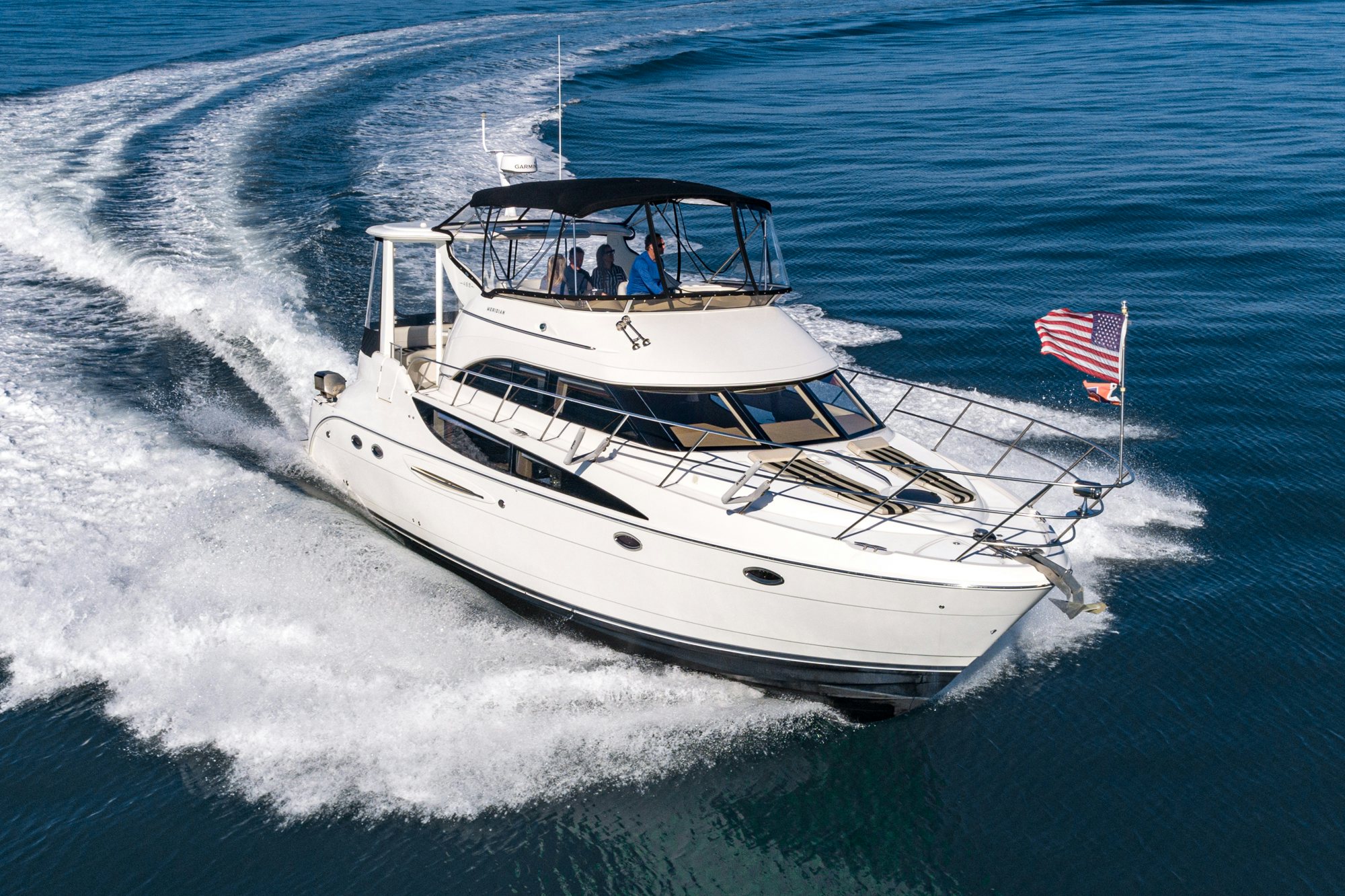 a boat with a flag on it aboard THE SEA IS FOR ME Yacht for Sale