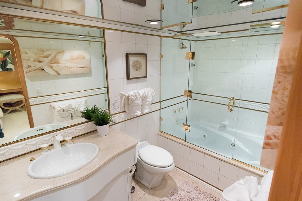 a bathroom with a glass shower aboard SUITE LIFE Yacht for Sale