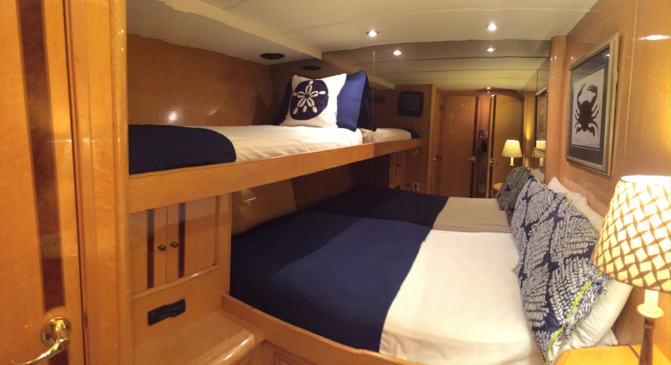a room with a bed and a desk aboard SUITE LIFE Yacht for Sale