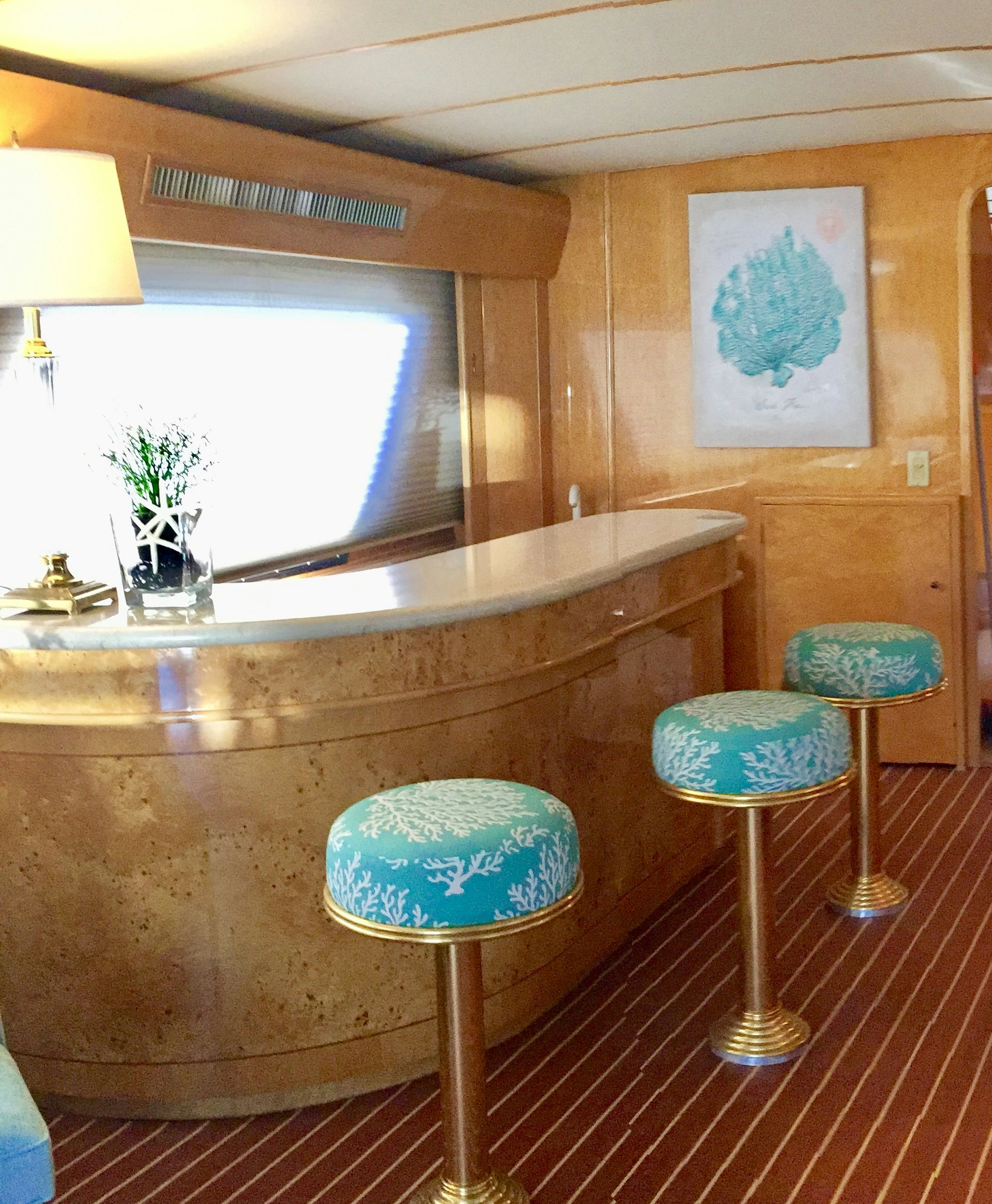 a large kitchen with stools aboard SUITE LIFE Yacht for Sale