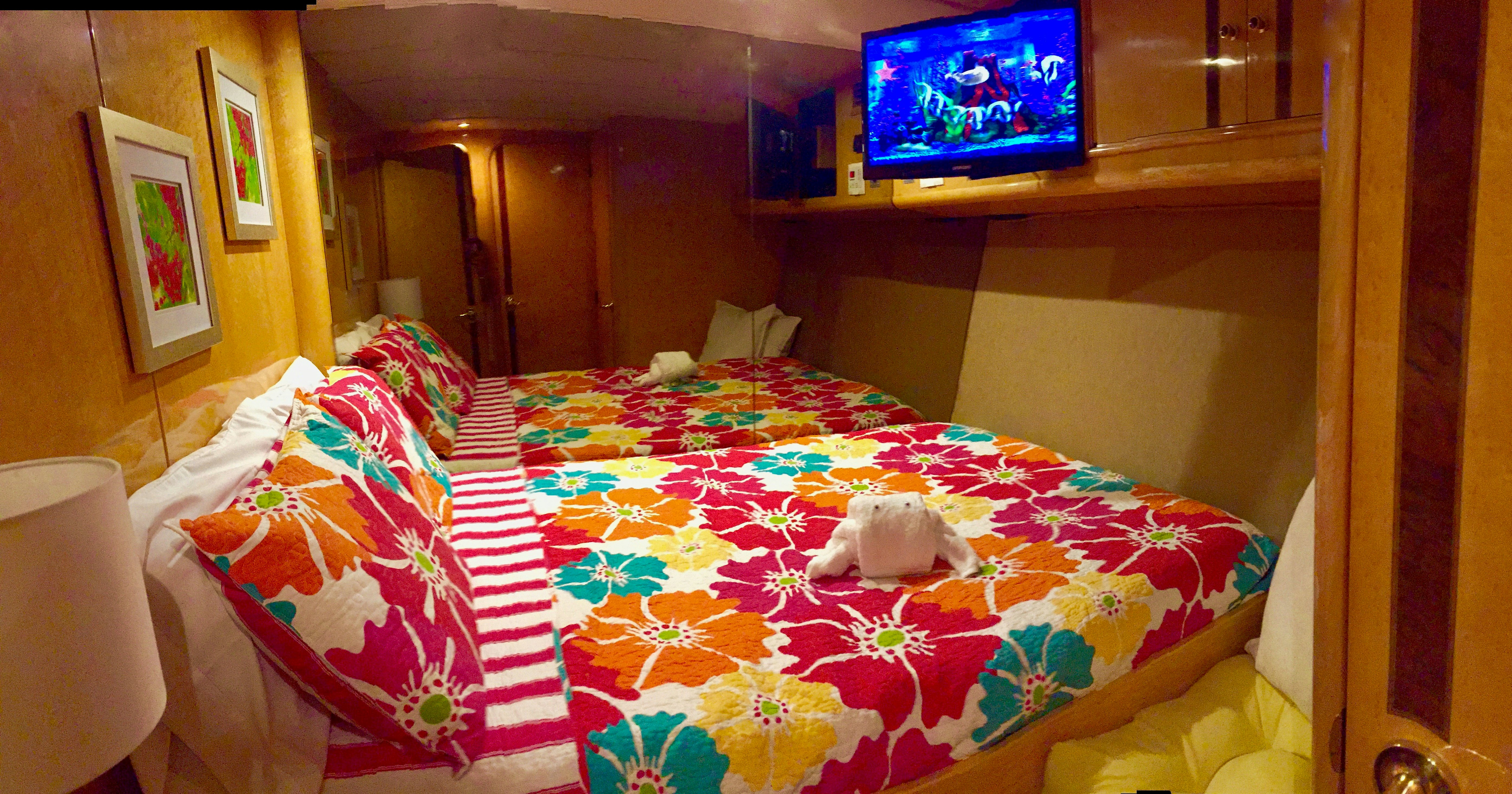 a teddy bear on a bed aboard SUITE LIFE Yacht for Sale