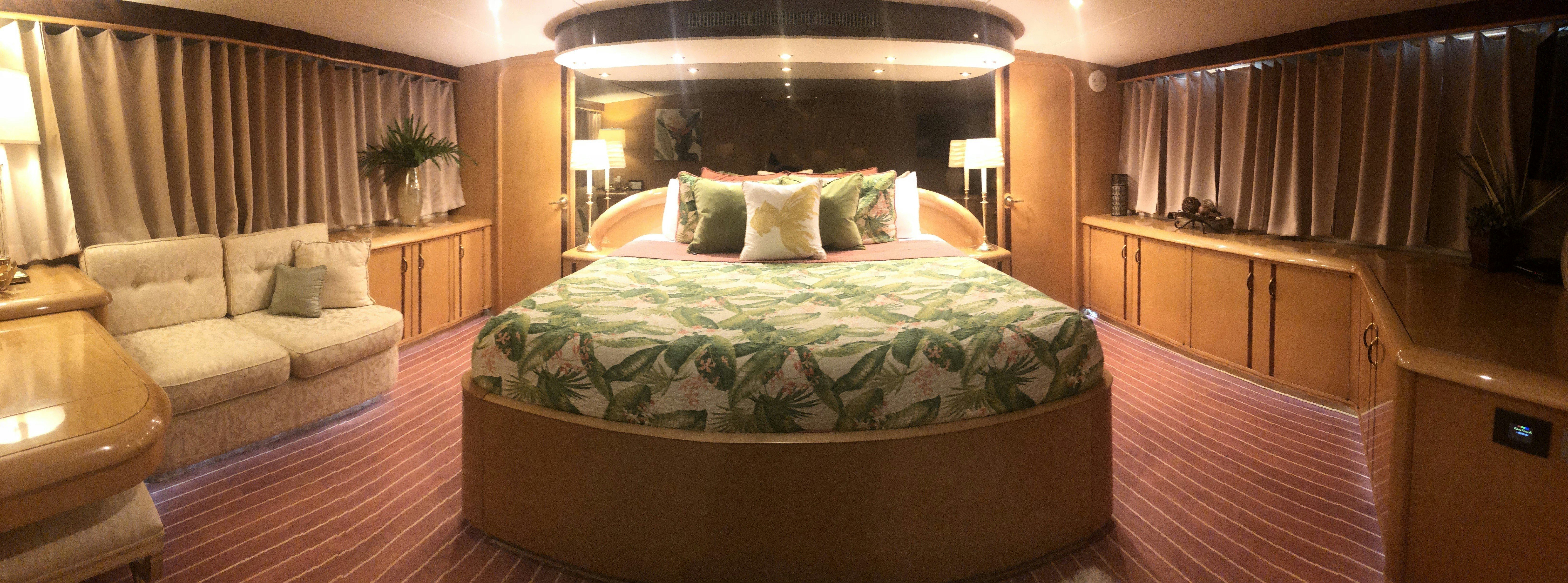 a large bed in a hotel room aboard SUITE LIFE Yacht for Sale