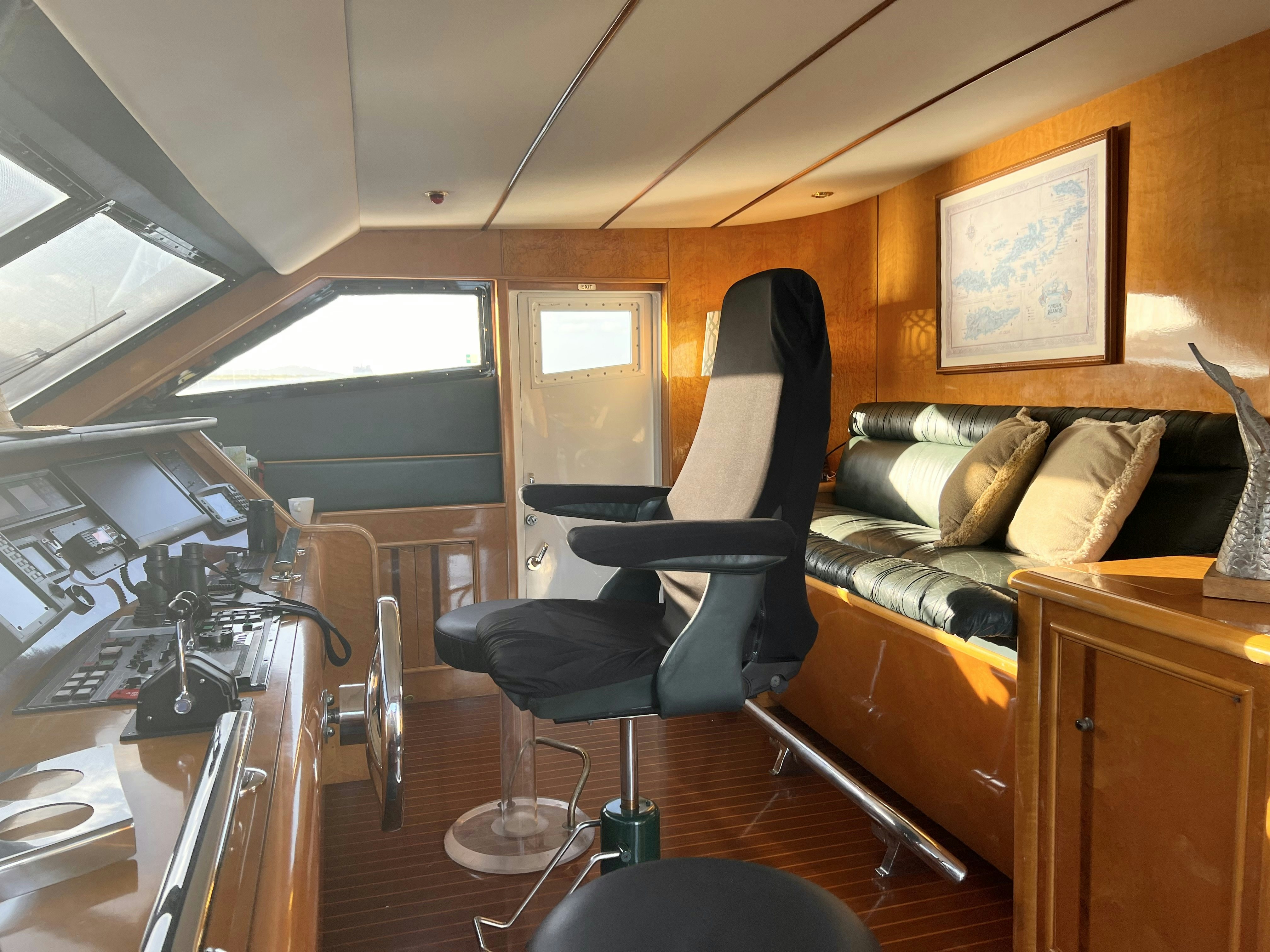 a room with a couch and a chair aboard SUITE LIFE Yacht for Sale
