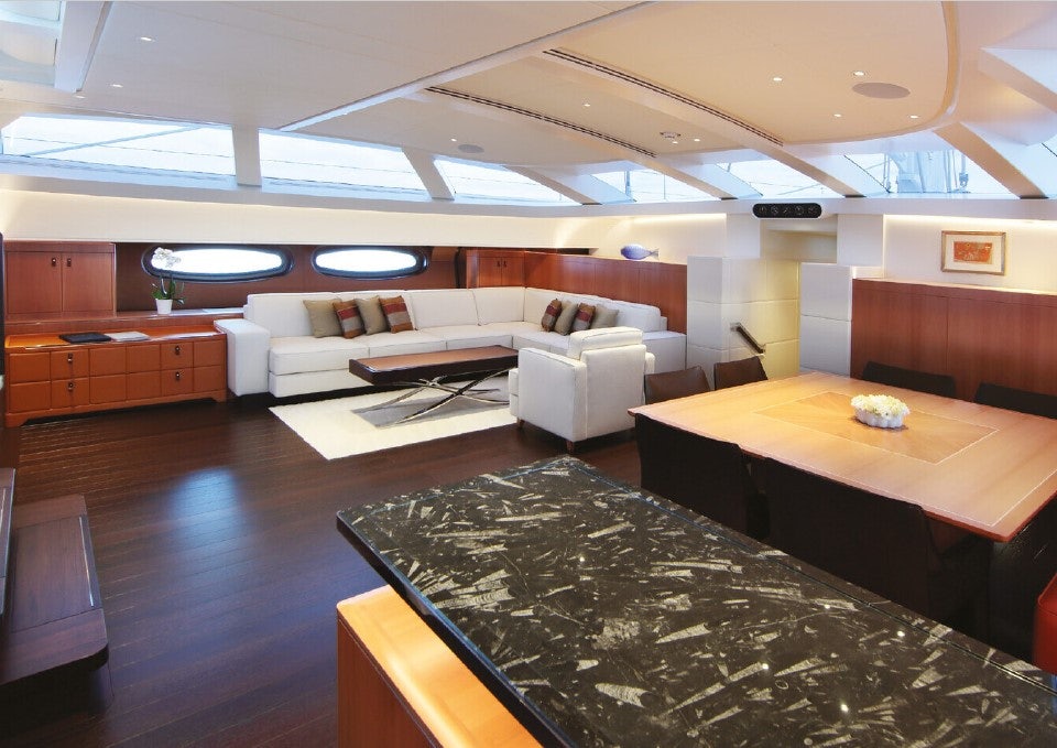 a room with a couch and a table aboard MIRASOL Yacht for Sale