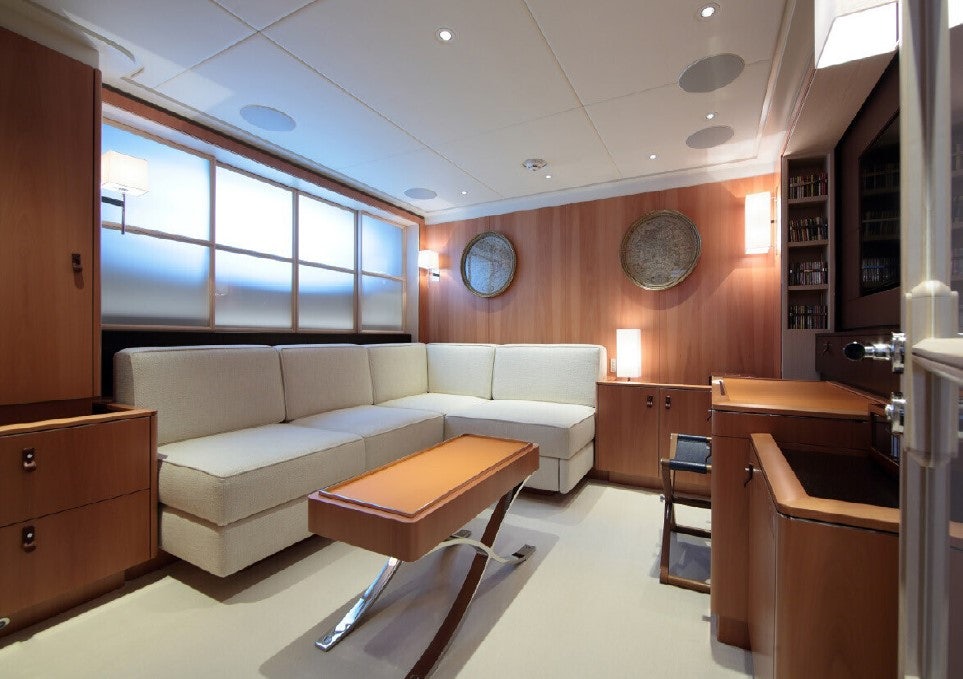 a living room with a couch and a table aboard MIRASOL Yacht for Sale