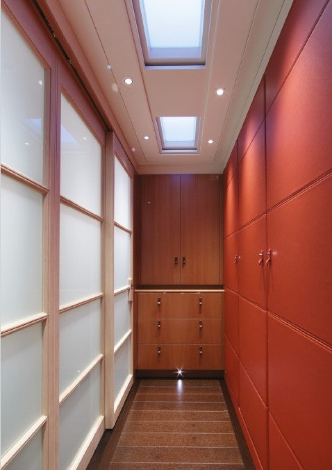a hallway with red walls aboard MIRASOL Yacht for Sale