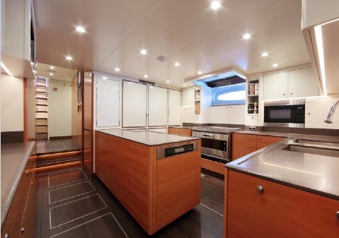 a kitchen with a large island aboard MIRASOL Yacht for Sale