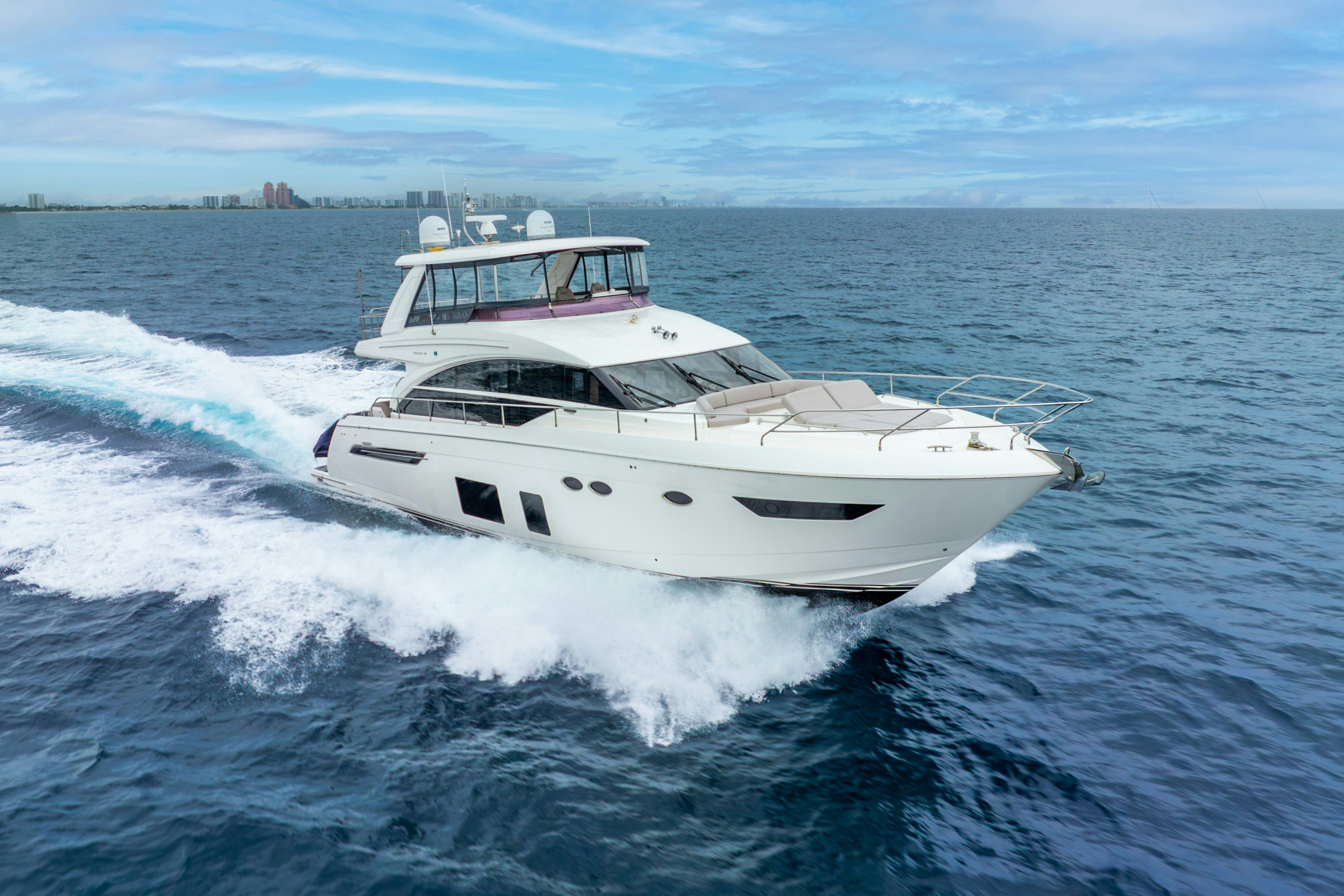 a white yacht on the water aboard MAMU Yacht for Sale