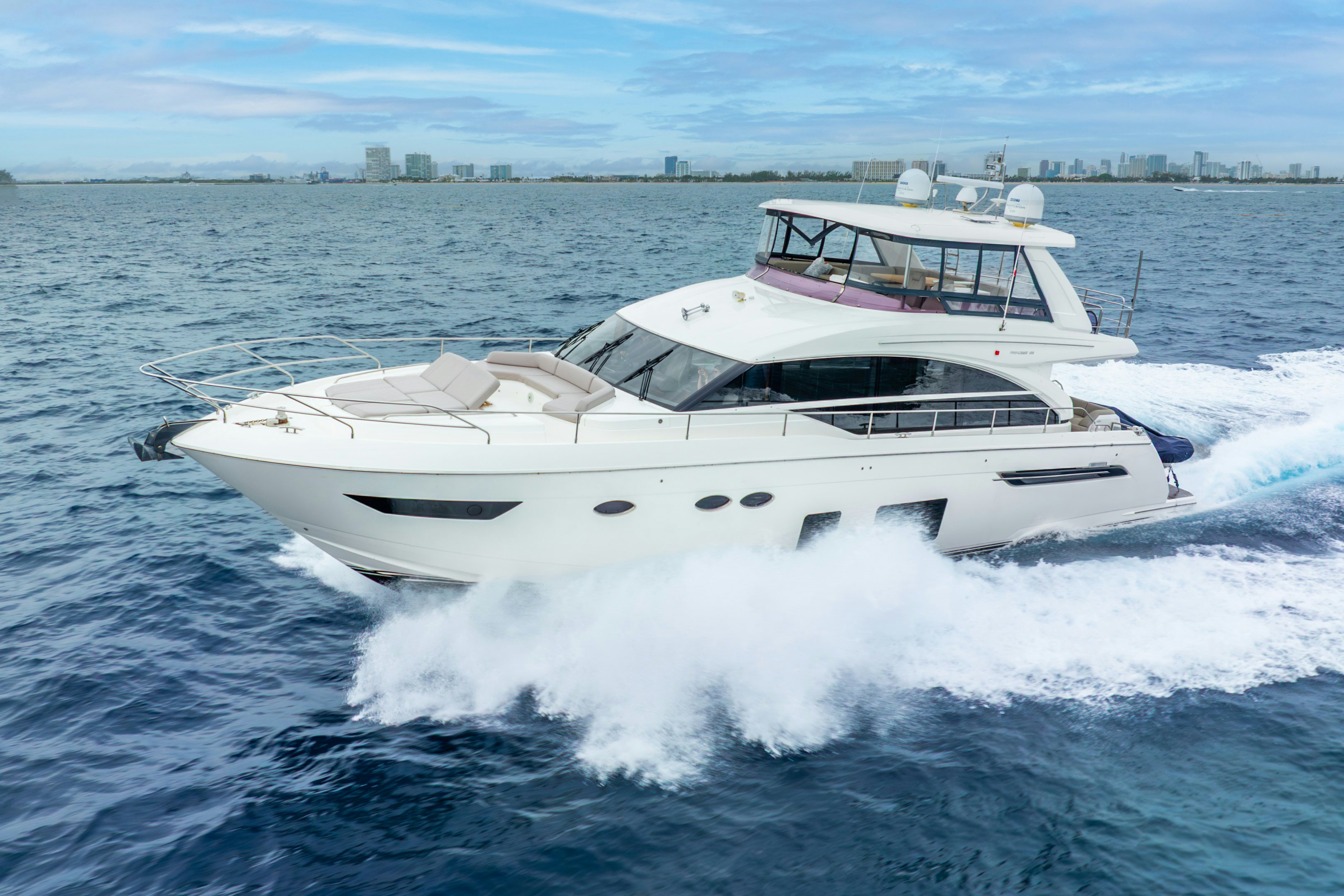 a white yacht on the water aboard MAMU Yacht for Sale