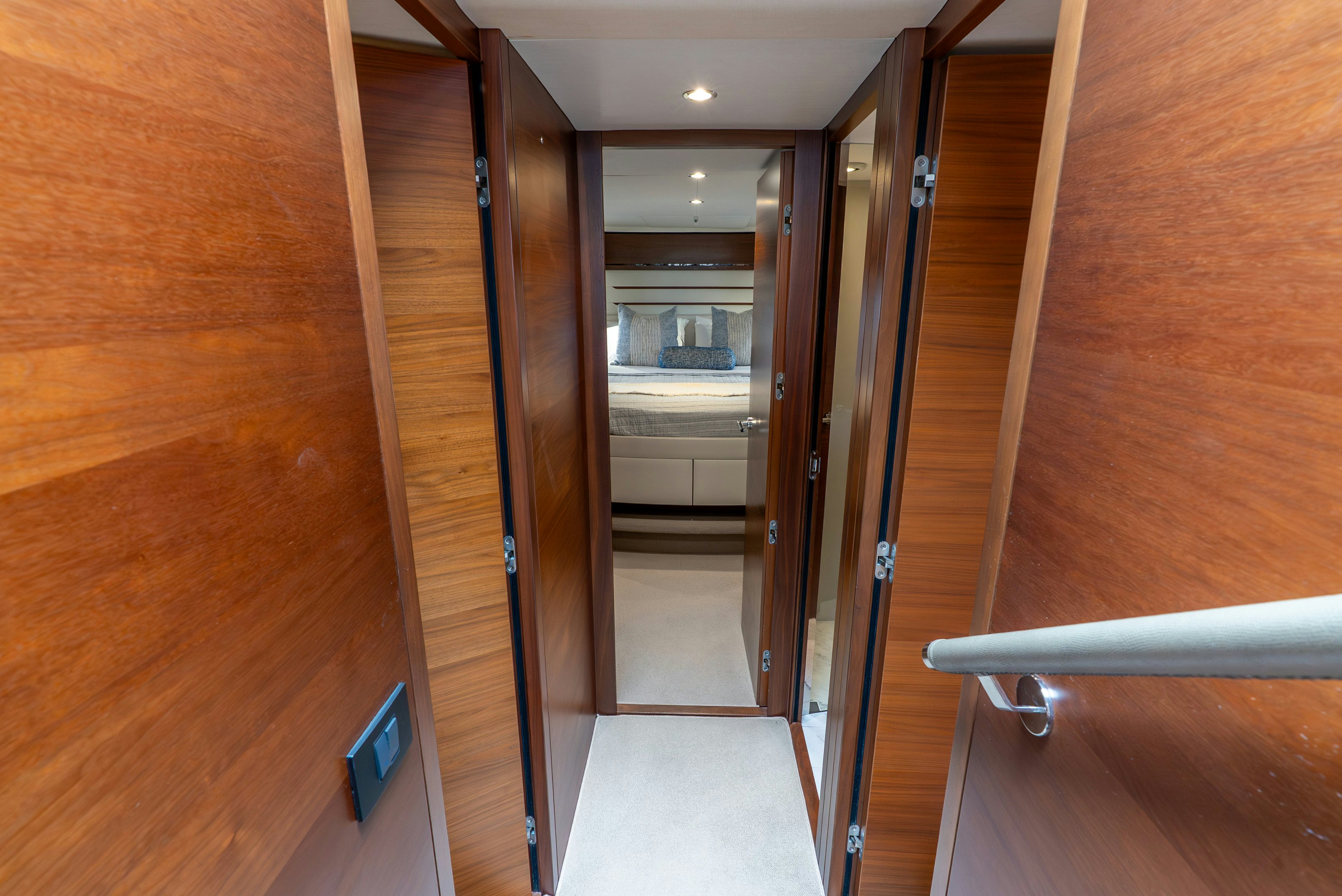 a hallway with glass doors aboard MAMU Yacht for Sale